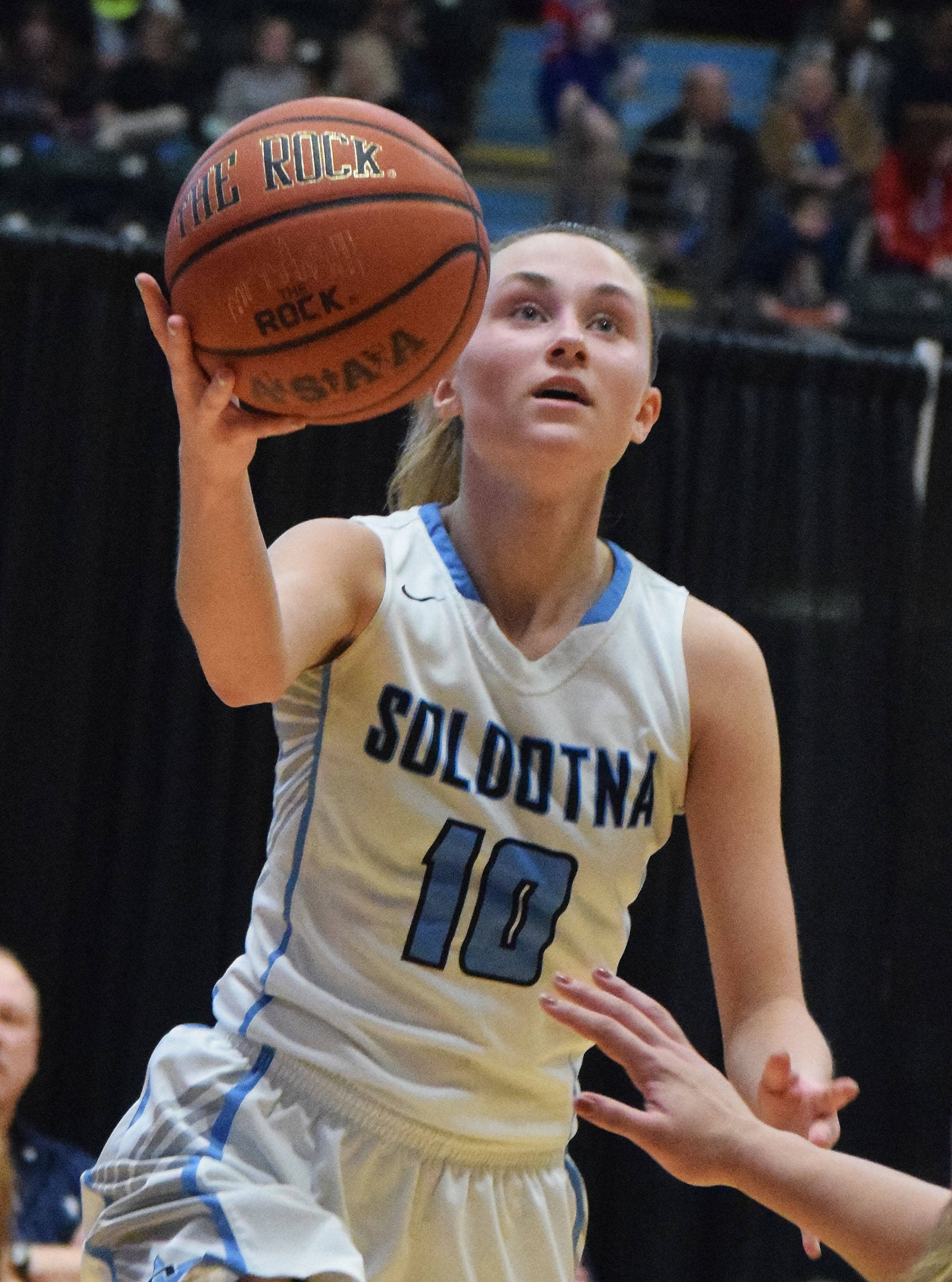 Soldotna’s Aliann Schmidt jumps up for a shot attempt Thursday, Mar. 21, 2019, against West Anchorage at the Class 4A state championship tournament at the Alaska Airlines Center in Anchorage. (Photo by Joey Klecka/Peninsula Clarion)