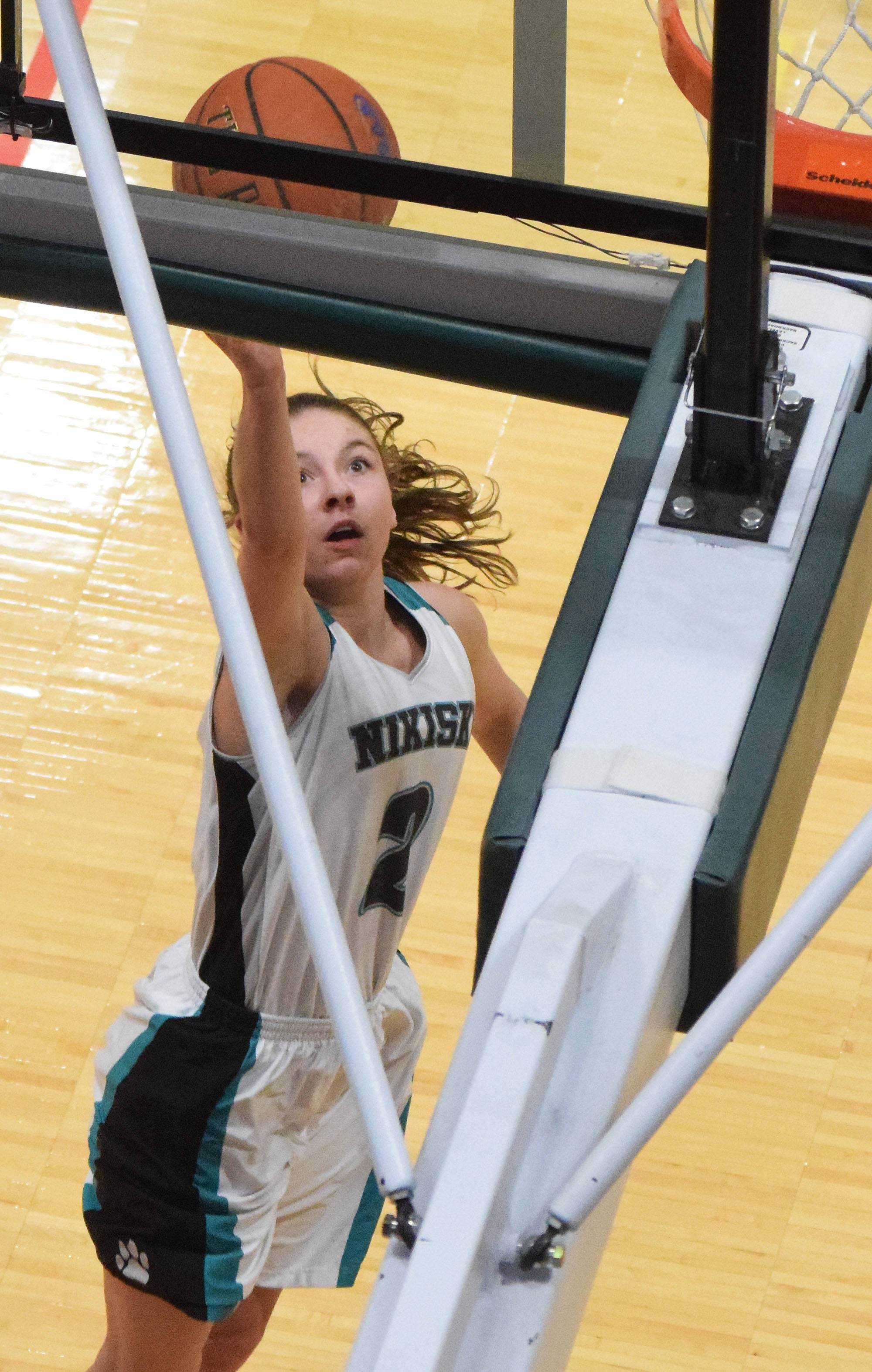 Nikiski’s America Jeffreys lays in a bucket Friday, March 22, 2019, against Barrow at the Class 3A girls state tournament at the Alaska Airlines Center in Anchorage. (Photo by Joey Klecka/Peninsula Clarion)