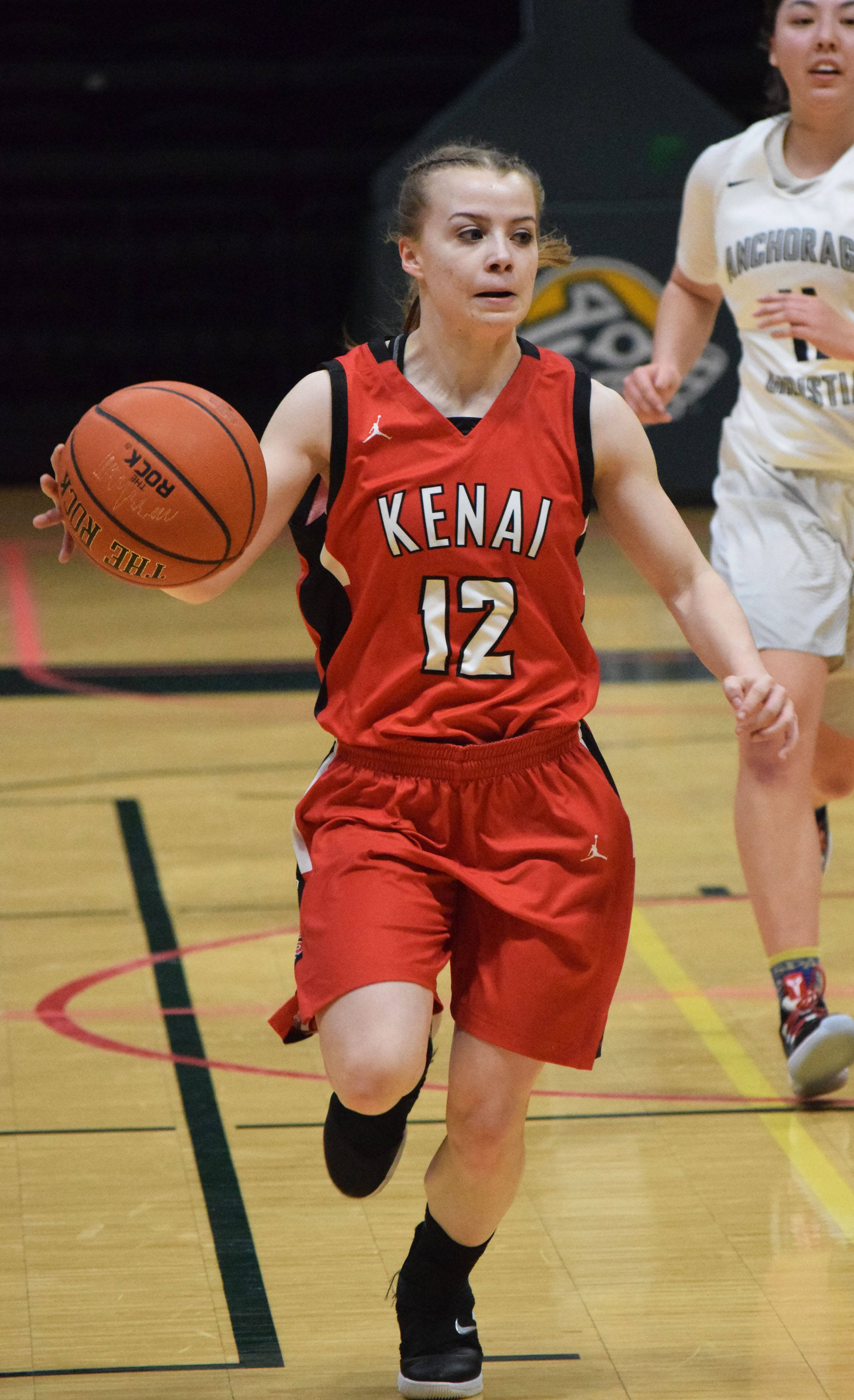 Kenai’s Hayley Maw dribbles the ball up the court Friday, March 22, 2019, against ACS at the Class 3A girls state tournament at the Alaska Airlines Center in Anchorage. (Photo by Joey Klecka/Peninsula Clarion)