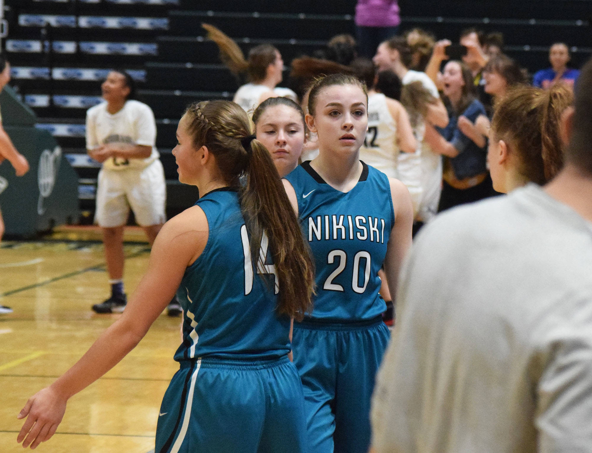 Bethany Carstens (20) walks back to the bench with her Nikiski teammates Saturday, March 23, 2019, following a loss to ACS in the Class 3A girls state basketball championship at the Alaska Airlines Center in Anchorage. (Photo by Joey Klecka/Peninsula Clarion)