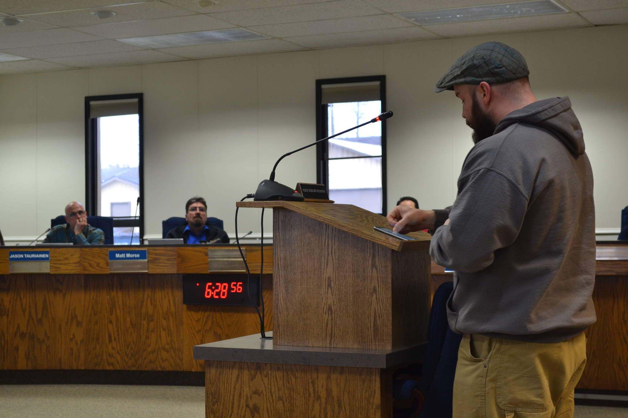 Dustin Poindexter, of Anchor Point, speaks to the Kenai Peninsula Borough School District Board of Education in support of his children’s school, Chapman School, on Thursday, March 21, 2019, in Soldotna, Alaska. (Photo by Victoria Petersen/Peninsula Clarion)