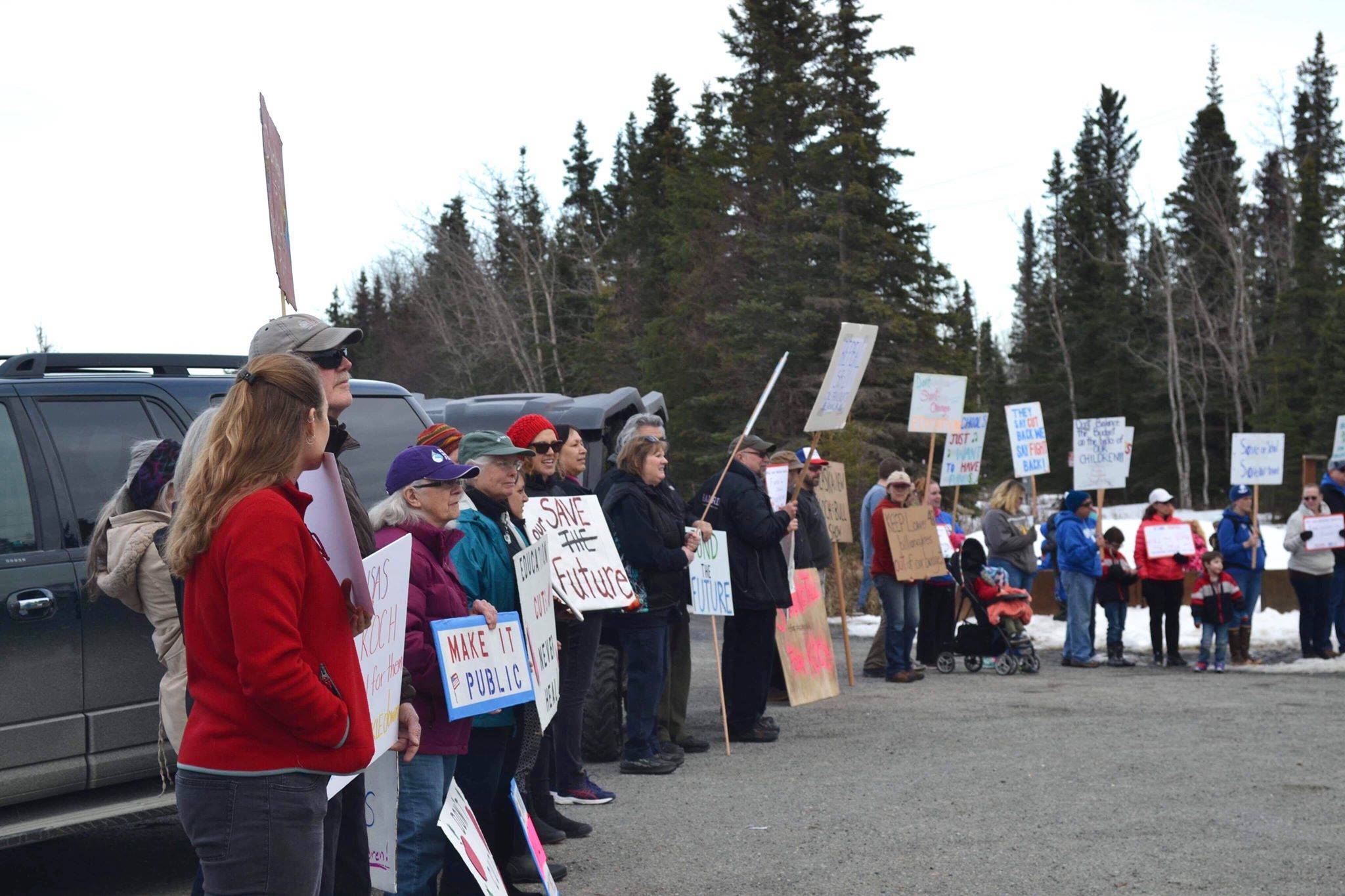 Protesters stand outside the Cannery Lodge in Kenai, Alaska, ahead of Gov. Mike Dunleavy’s presentation about his proposed budget on March 26, 2019. (Photo by Victoria Petersen/Peninsula Clarion)