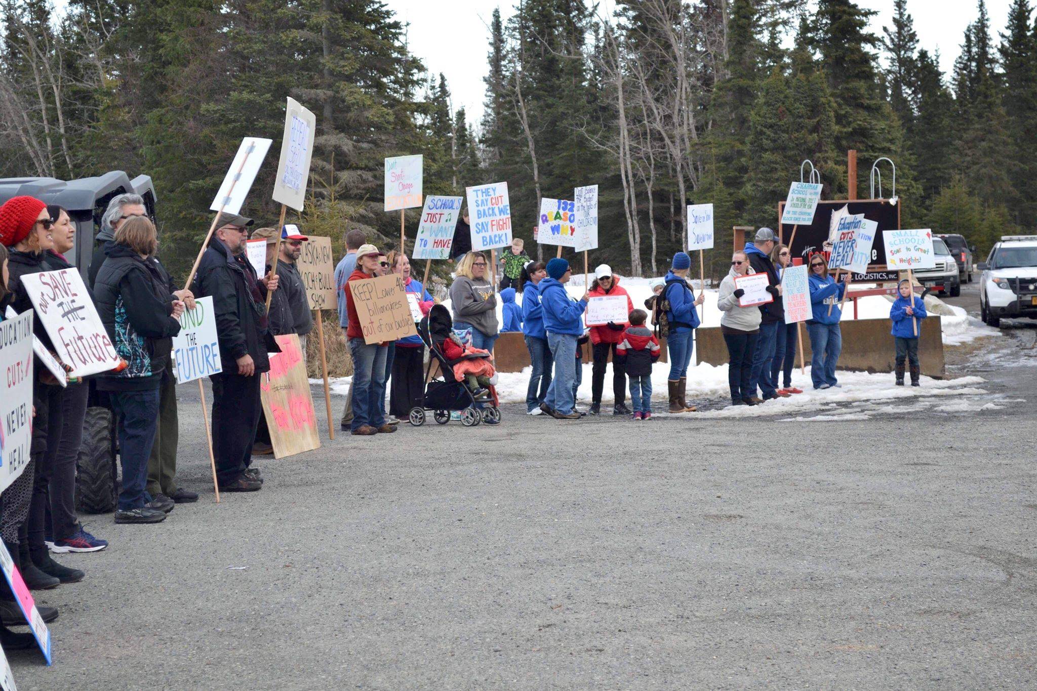 Protestors stand outside the Cannery Lodge in Kenai, AK ahead of Governor Dunleavy’s presentation about his proposed budget on March 26, 2019. (Photo by Victoria Petersen/Peninsula Clarion)