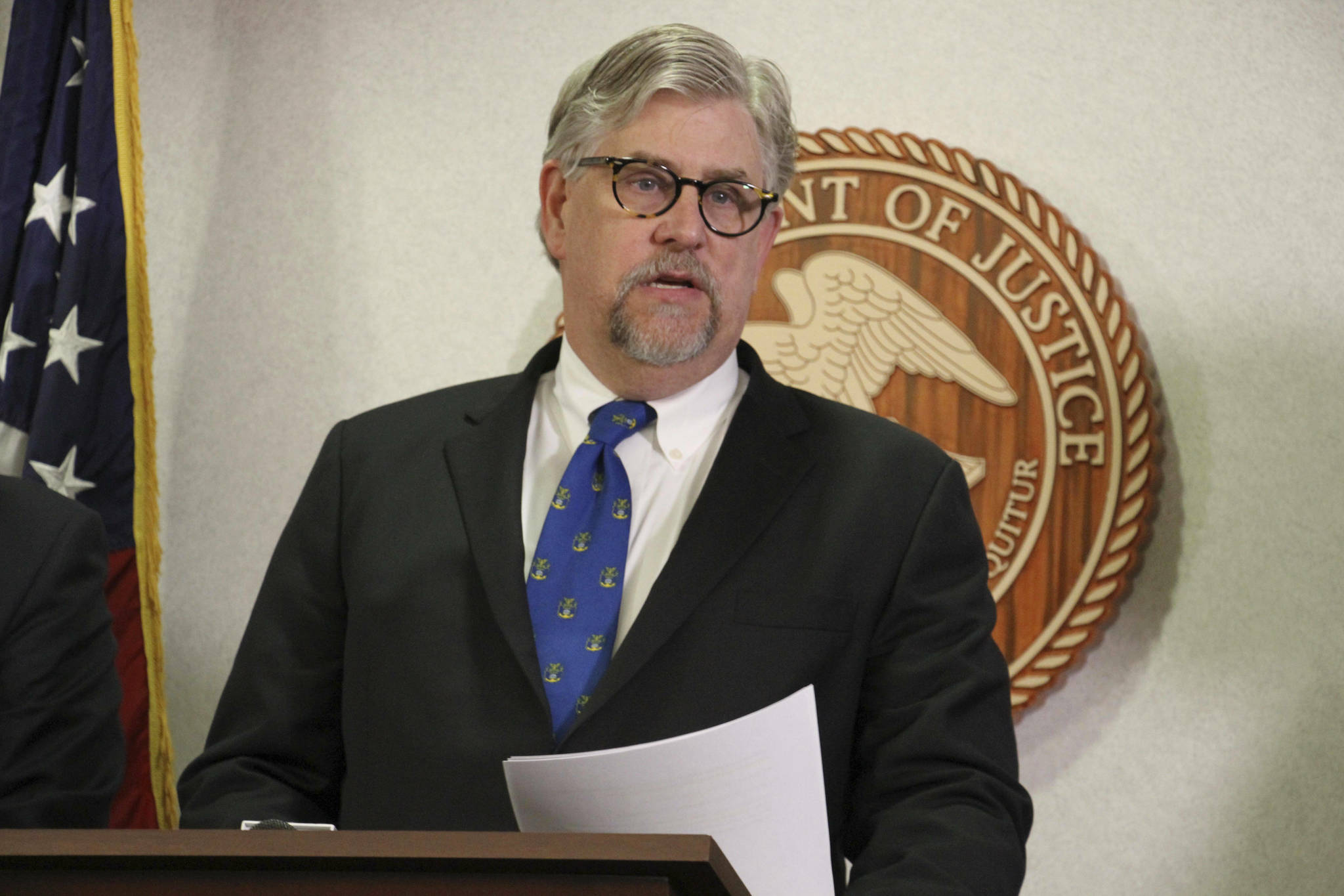 Bryan Schroder, Alaska’s U.S. Attorney announces that several members of a white supremacist gang operating in Alaska prisons or shipped to facilities in Colorado and Arizona, have been charged in a racketing enterprise in Anchorage, Alaska, Wednesday, March 27, 2019. Members who sport Nazi tattoos face racketeering charges including murder, kidnapping, assault, and distribution of narcotics and firearms. (AP Photo/Mark Thiessen)