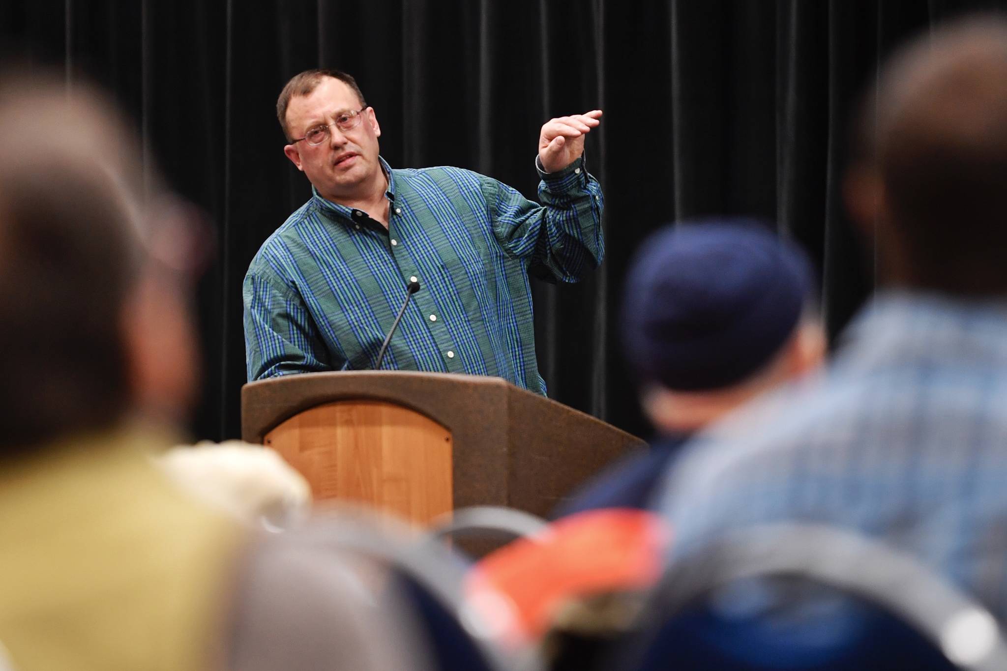 Ed Jones, of the Alaska Department Fish and Game, speaks at a King Salmon Symposium at Centennial Hall on Wednesday, March 27, 2019. The event was sponsored by the Territorial Sportsmen, Inc. (Michael Penn | Juneau Empire)