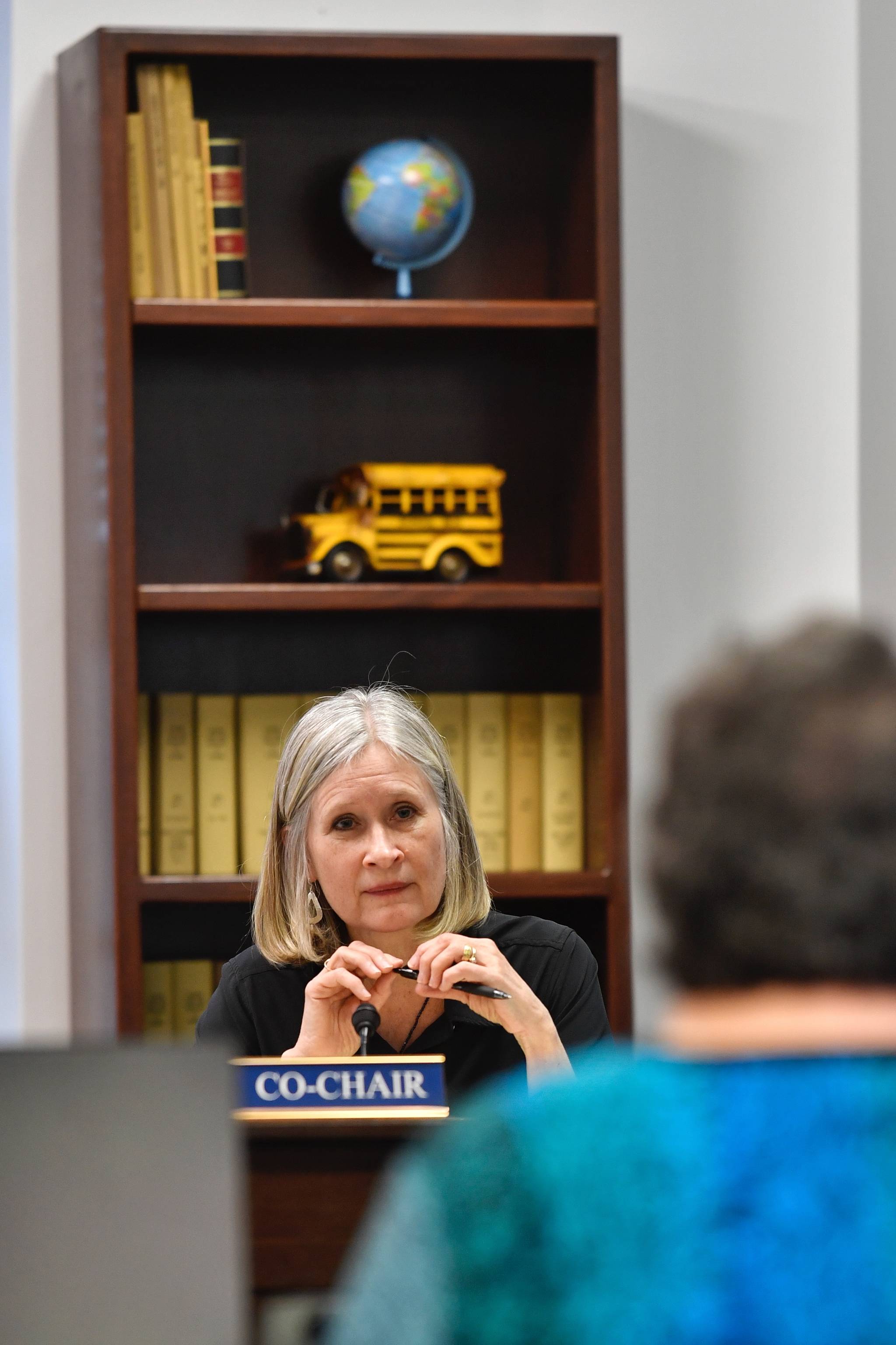 Rep. Andi Story, D-Juneau, listens to Patience Frederiksen, State Librarian and Head of Library Developement, during a House Education Committee meeting on Monday, April 1, 2019. (Michael Penn | Juneau Empire)