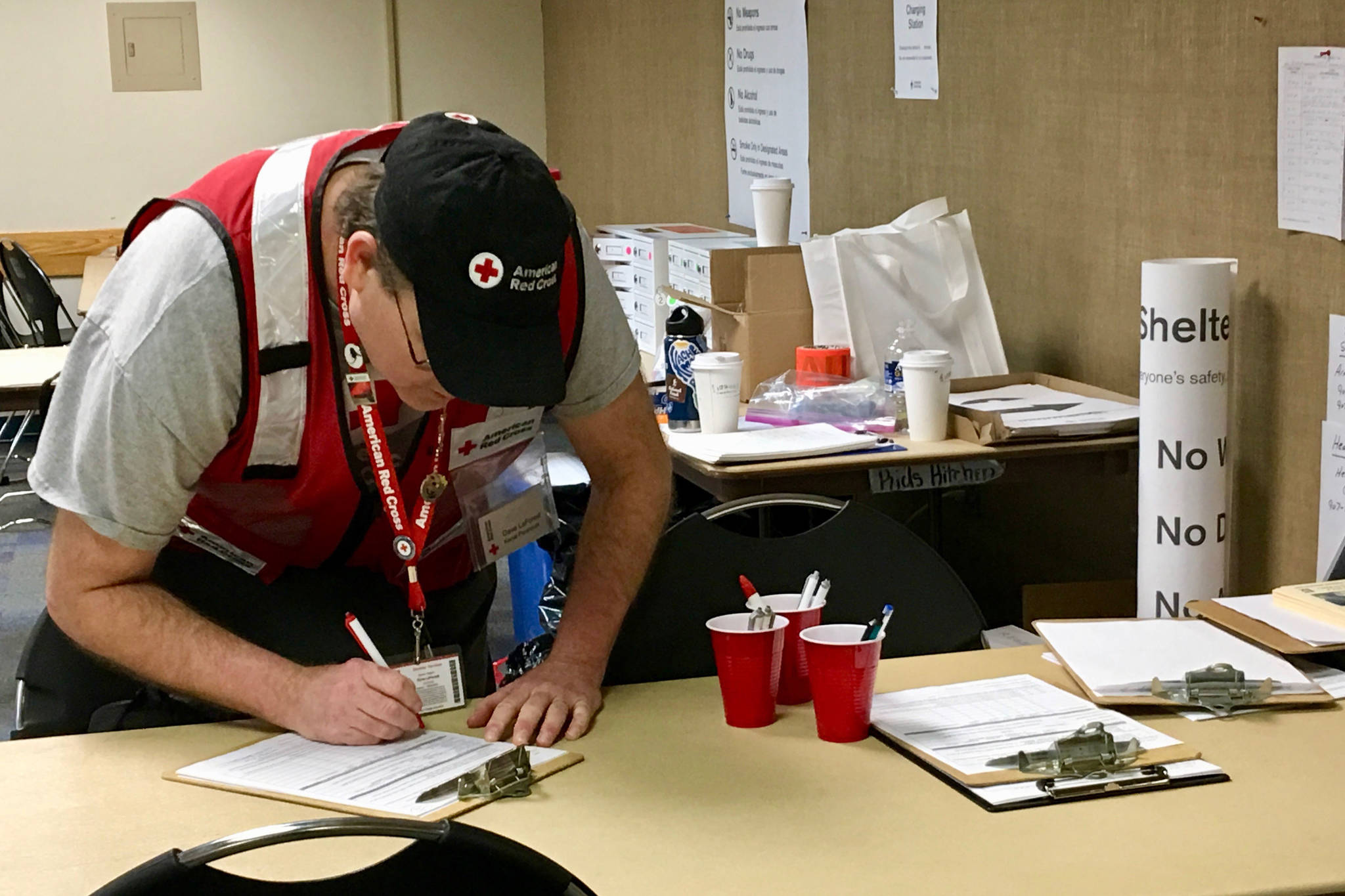 Kenai Peninsula Disaster Action Team Coordinator Dave LaForest assists with sheltering displaced Anchorage residents following the magnitude 7.1 earthquake. (Photo courtesy of Abby Charles/American Red Cross)