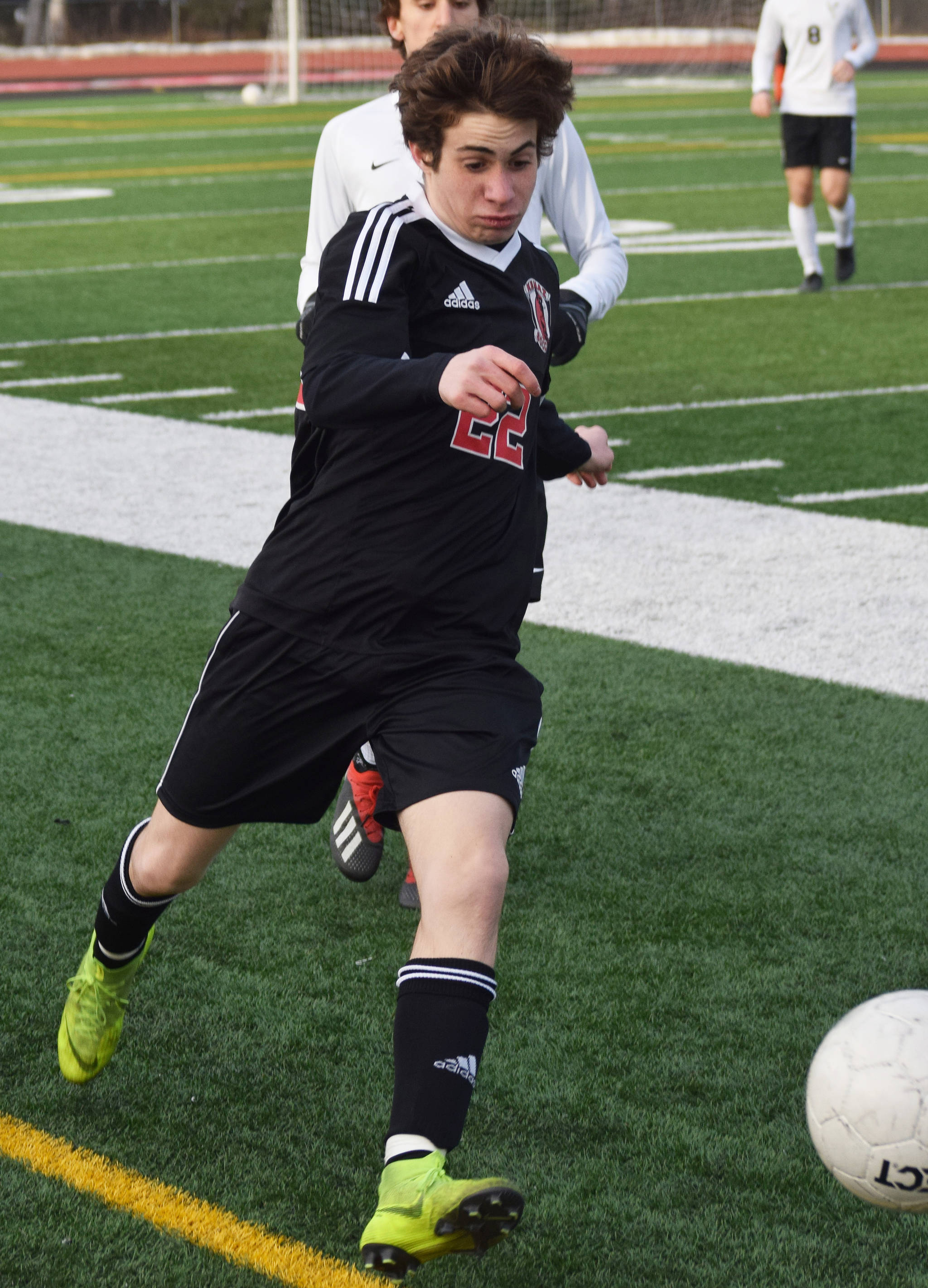 Kenai Central sophomore Francisco Garmen Munarriz dribbles the ball up field against West Anchorage in a nonconference game Thursday, April 4, 2019, at Ed Hollier Field. (Photo by Joey Klecka/Peninsula Clarion)