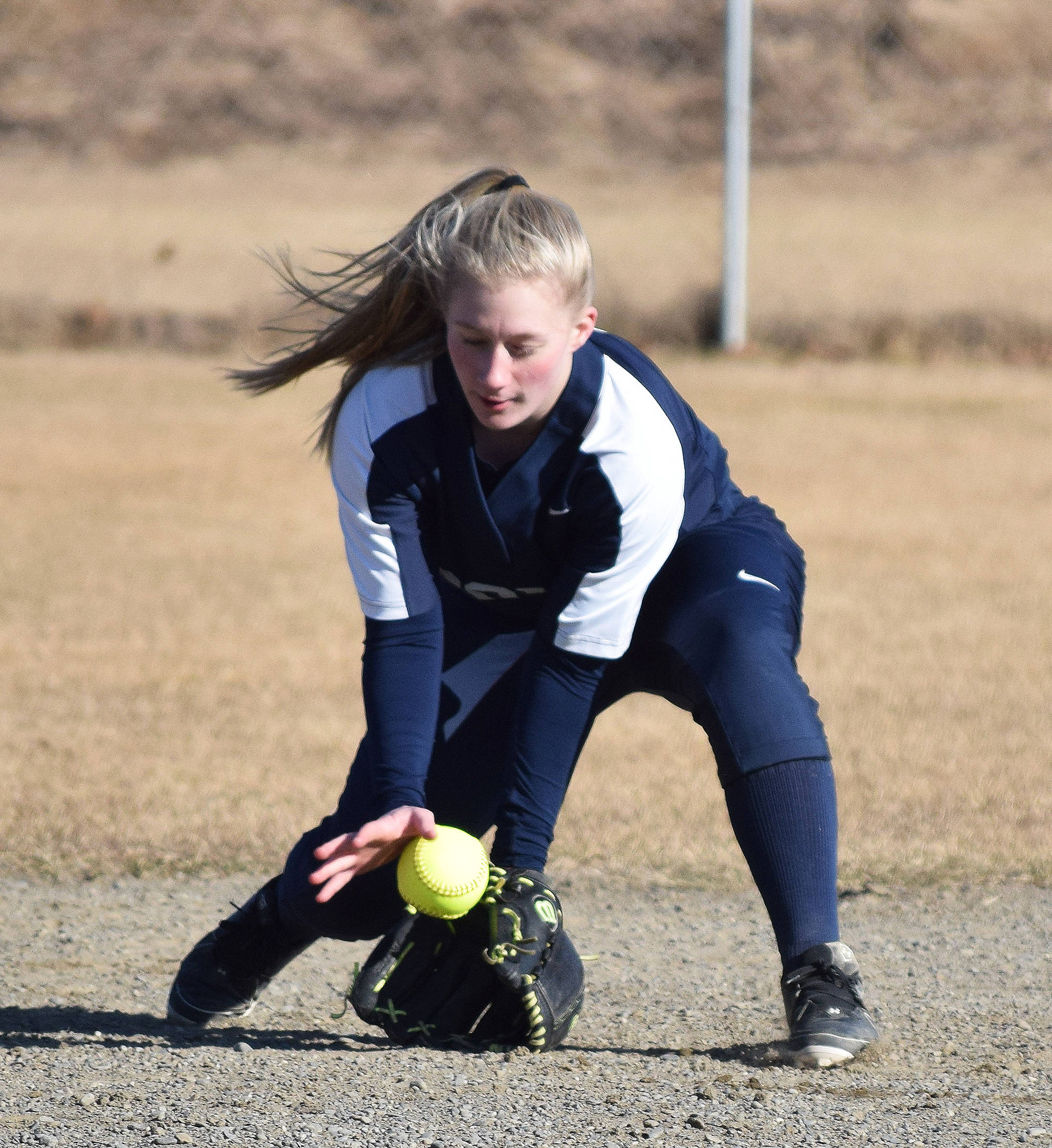 Soldotna shortstop Ashley McDonald scoops up a groundball from a Homer batter May 1, 2018, at the Soldotna Little League fields. (Photo by Joey Klecka/Peninsula Clarion)