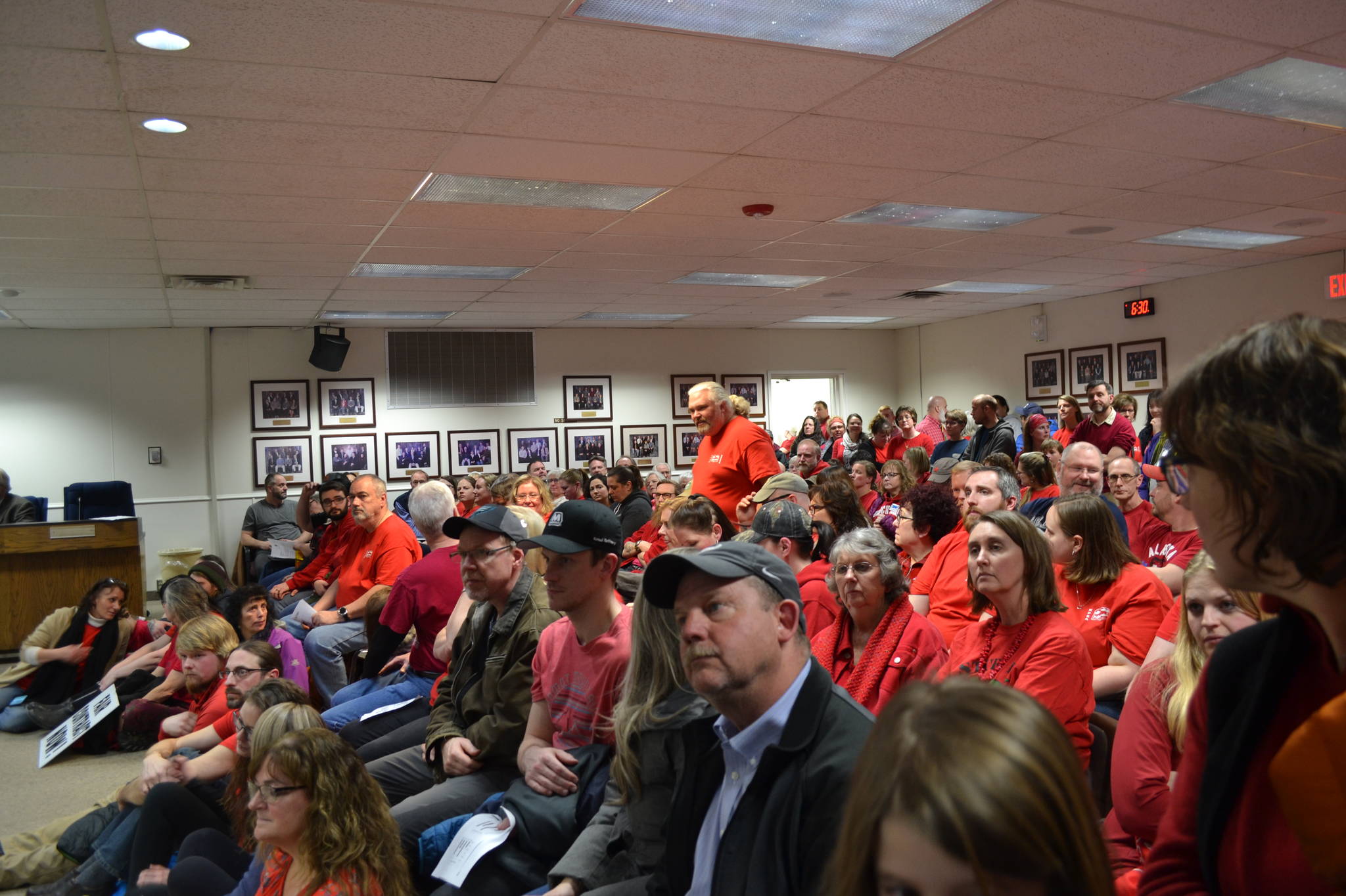 Teachers and support staff from across the Kenai Peninsula fill the Betty J. Glick Borough Assembly Chambers during the Kenai Peninsula Borough School District Education Board meeting in Soldotna, Alaska on Monday, Feb. 11, 2019. (Photo by Victoria Petersen/Peninsula Clarion)