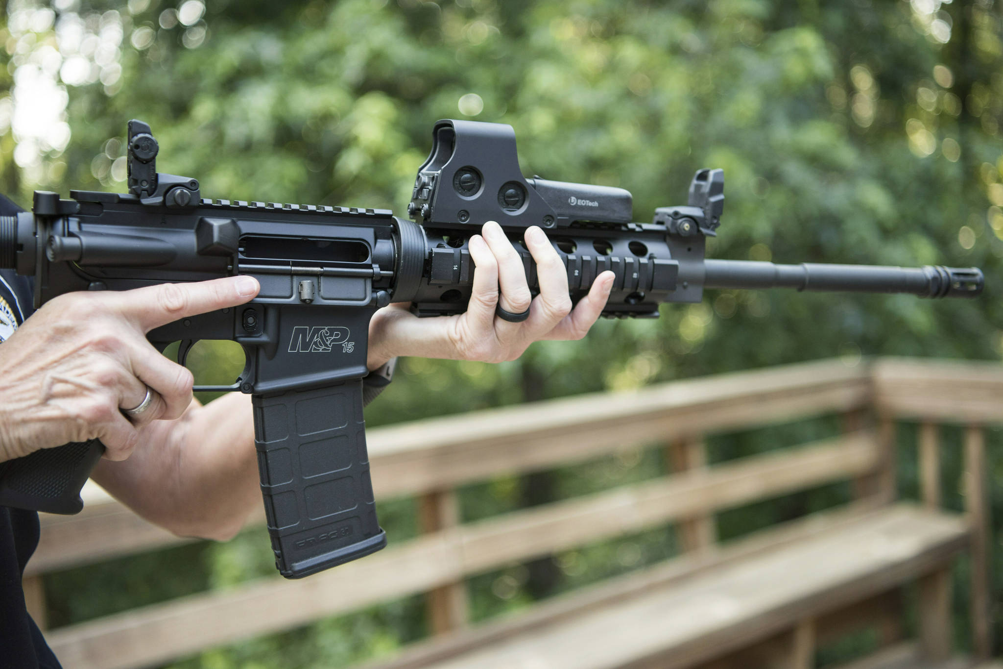 An AR-15 is held. (Lisa Marie Pane | Associated Press File)
