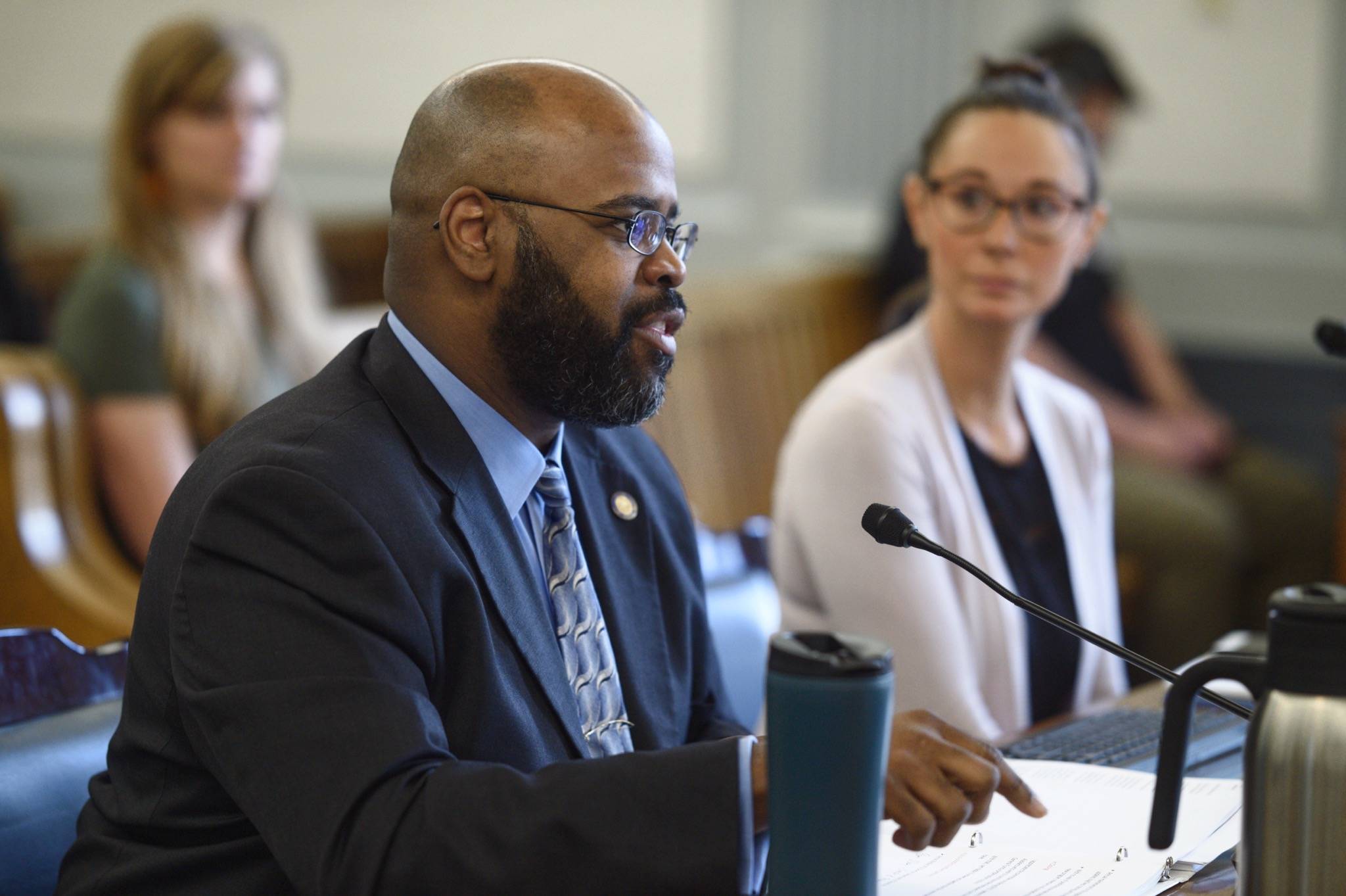 Sen. David Wilson, R-Wasilla, speaks about his bill to allow residents to donate their Permanent Fund Dividend back to the state’s general fund during a Senate Finance Committee meeting on Monday. Anne Weske, Director of the Alaska Permanent Fund Dividend, right, also spoke to the committee. (Michael Penn/Juneau Empire)