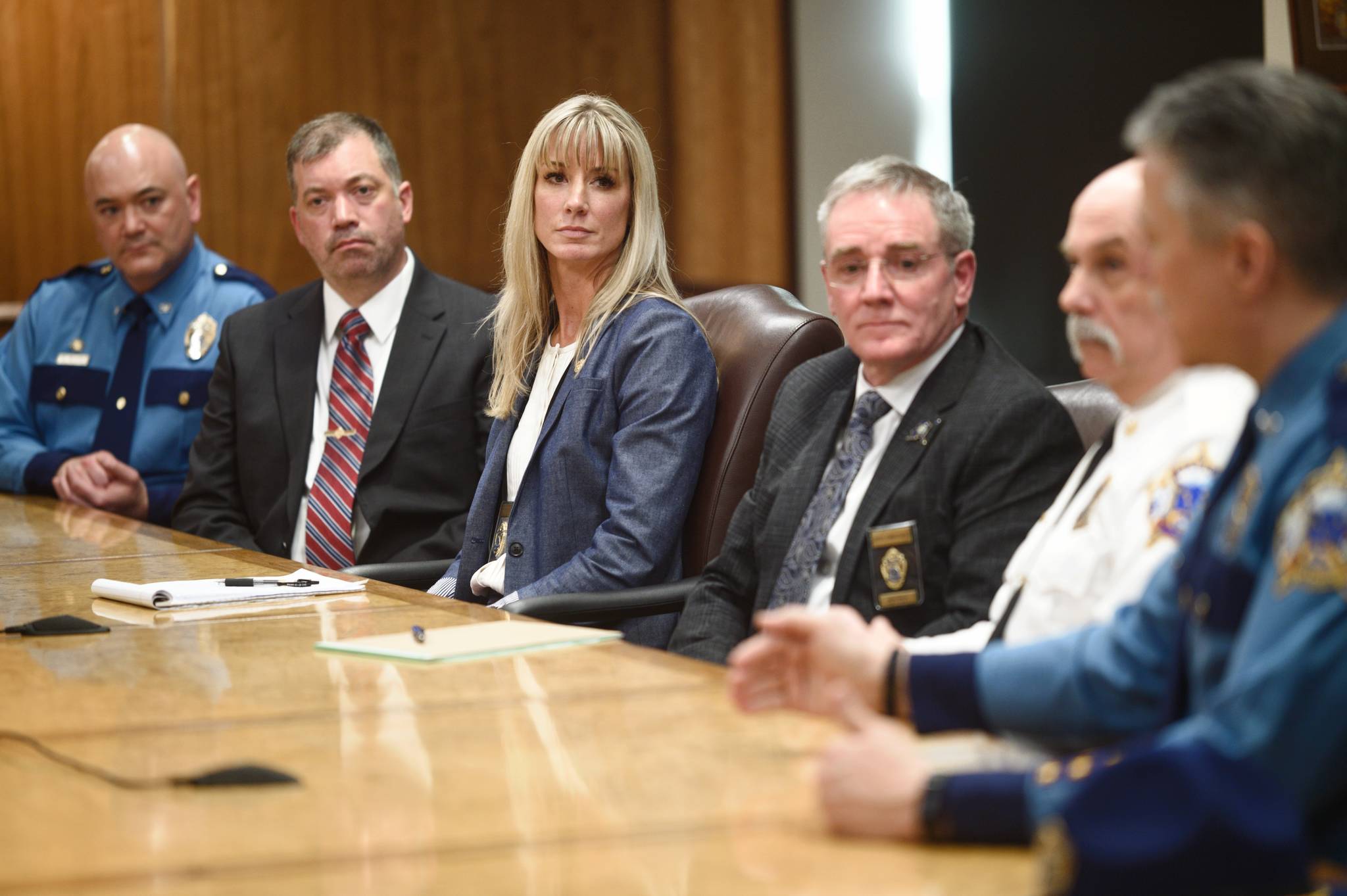 Amanda Price, Commissioner of the Department of Public Safety, center, is surrounded by Department of Public Safety officials during a press conference on her confirmation to the position at the Capitol on Tuesday, April 16, 2019. (Michael Penn | Juneau Empire)