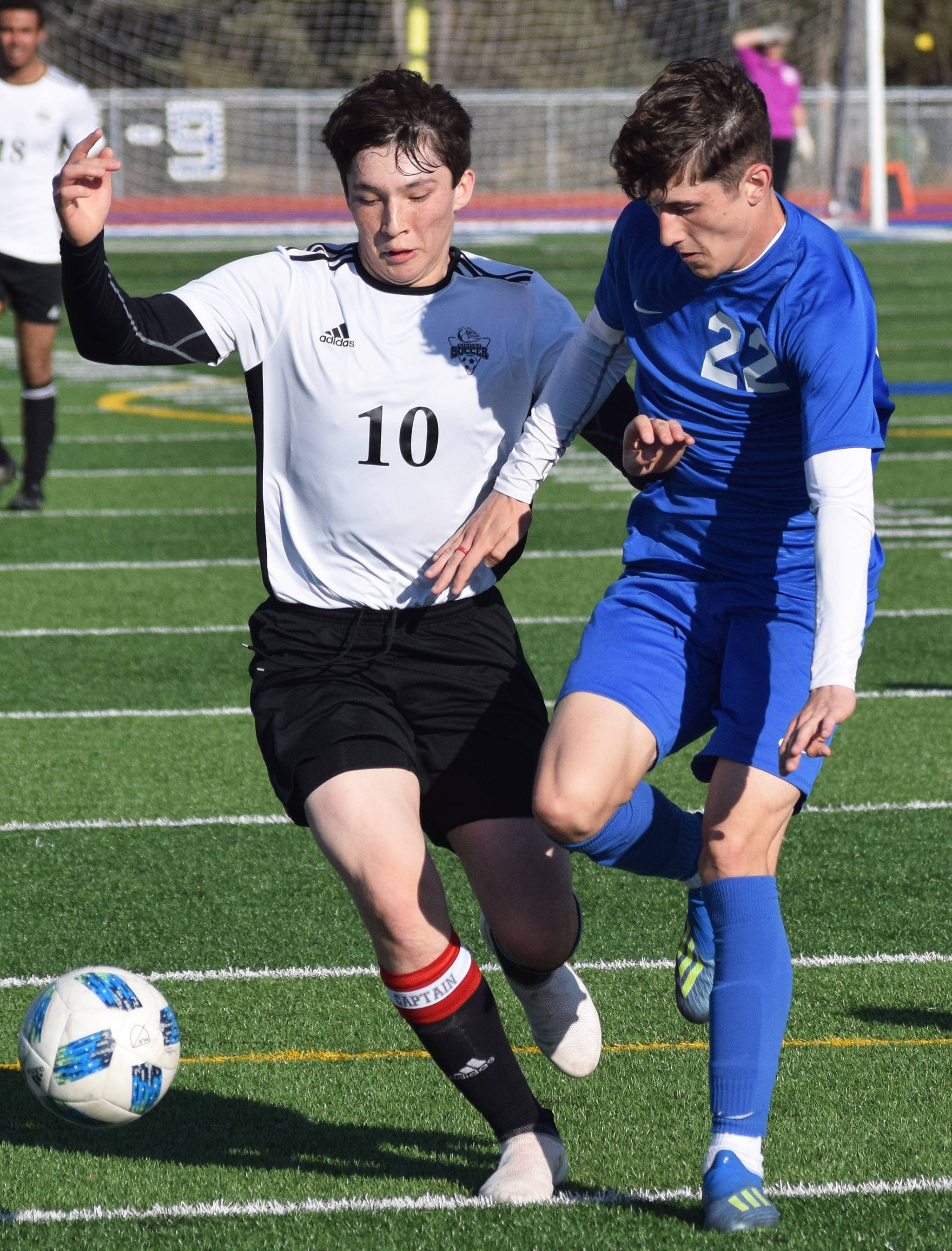 Nikiski’s Michael Mysing (10) and Soldotna’s Josh Heiber battle for possession Tuesday in a Peninsula Conference game at Soldotna High School. (Photo by Joey Klecka/Peninsula Clarion)
