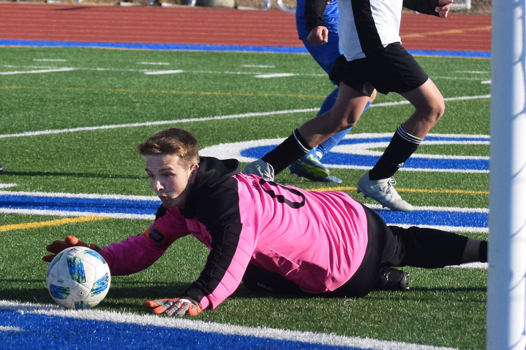 Nikiski goalkeeper Michael Eiter corrals a save Tuesday in a Peninsula Conference game at Soldotna High School. (Photo by Joey Klecka/Peninsula Clarion)