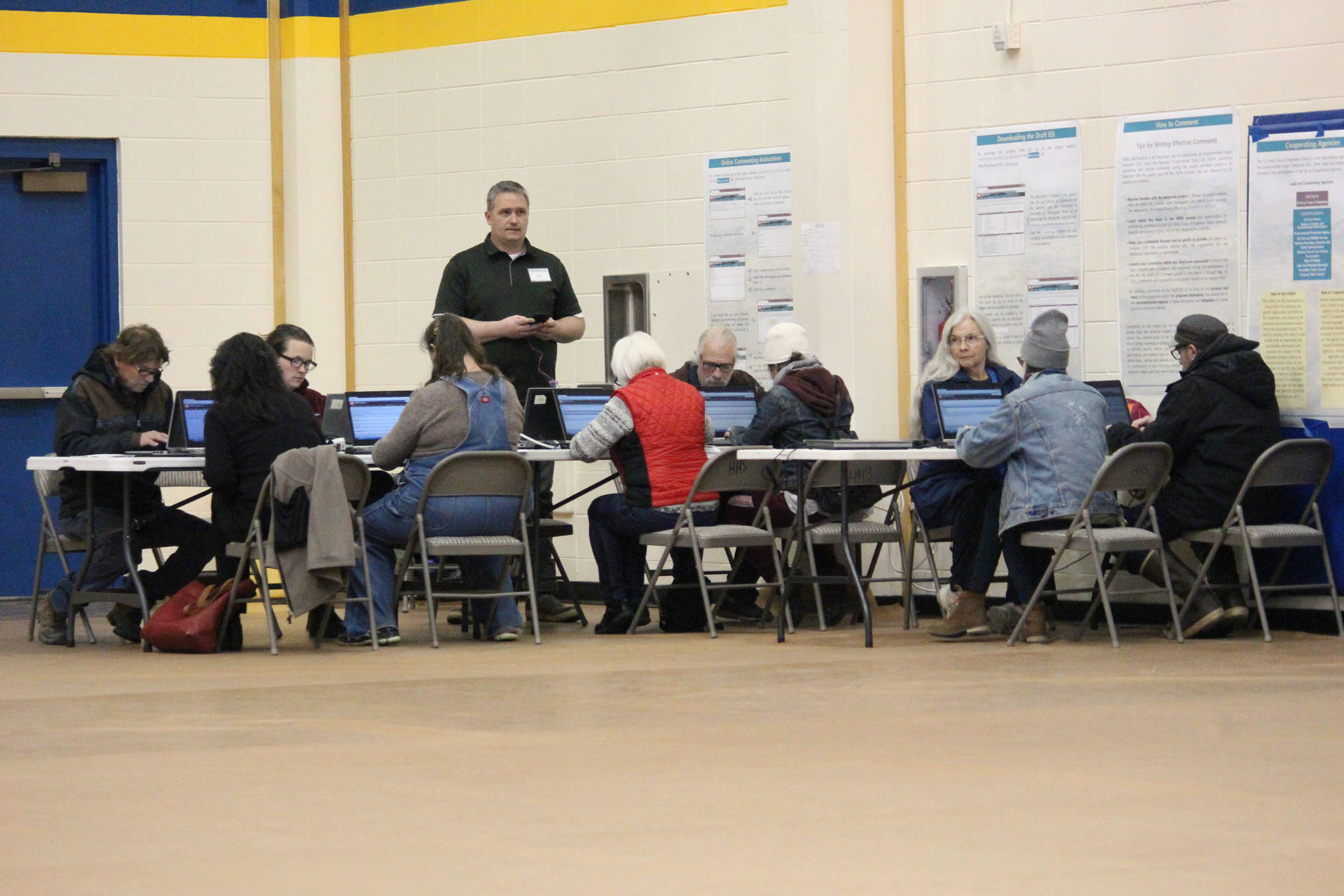 Community members submit comments about the Draft EIS for the proposed Pebble Mine to the Army Crops of Engineers through computers set up at an April 11, 2019 public hearing at Homer High School in Homer, Alaska. (Photo by Megan Pacer/Homer News)