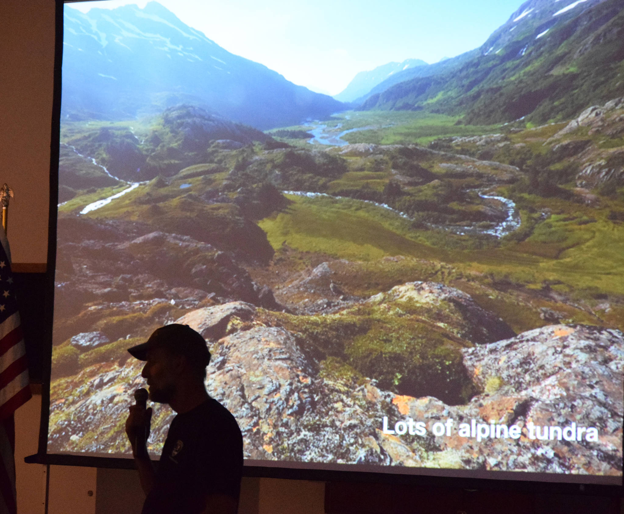 Bretwood Higman and Eric Clarke present a slideshow discussing work being done on the Tutka Backdoor Trail near Kachemak Bay, Wednesday, April 17, 2019, at the Kenai Visitors and Cultural Center. (Photo by Joey Klecka/Peninsula Clarion)