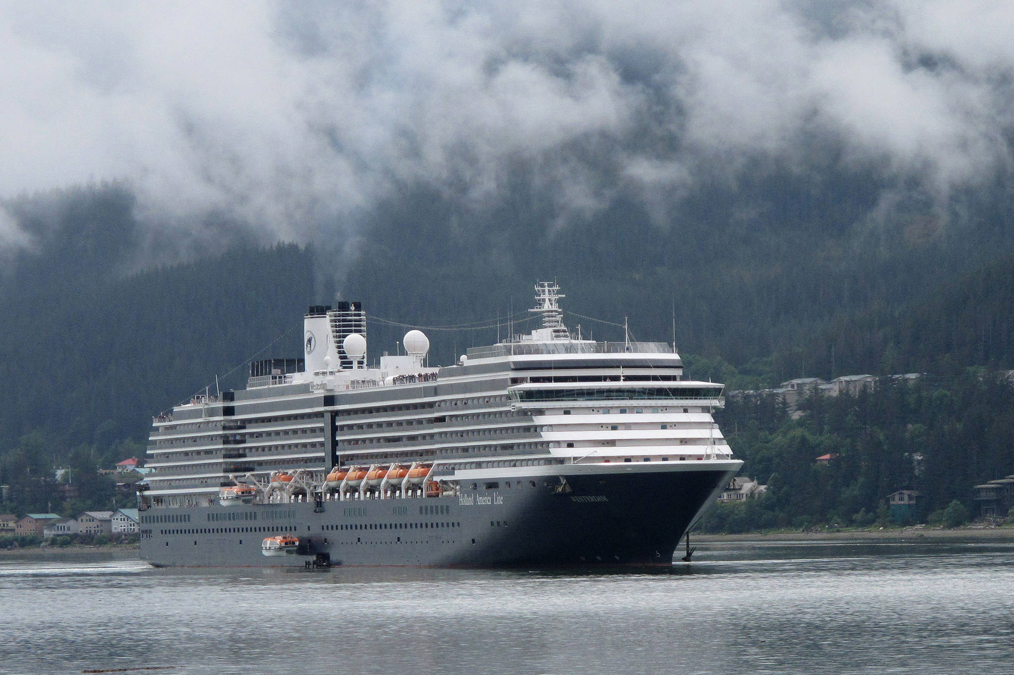 In this Aug. 29, 2011 file photo, the Holland America Westerdam, is shown in Juneau, Alaska. A federal judge in Miami threatened on Wednesday, April 10, 2019, to temporarily block Carnival Corp. from docking cruise ships at ports in the United States as punishment for a possible probation violation. (AP Photo/Becky Bohrer, File)