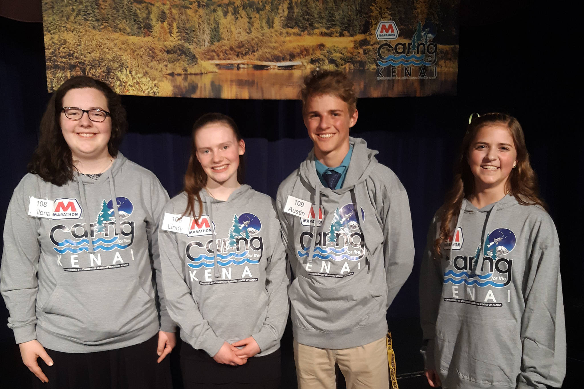 From left, the Caring for the Kenai finalists Akilena Veach and Lindy Guernsey (second place), Austin Cline (first place), and Anna DeVolld (third place) pose for a photo at Kenai Central High School in Alaska on Thursday, April 18, 2019. (Photo by Brian Mazurek/Peninsula Clarion)