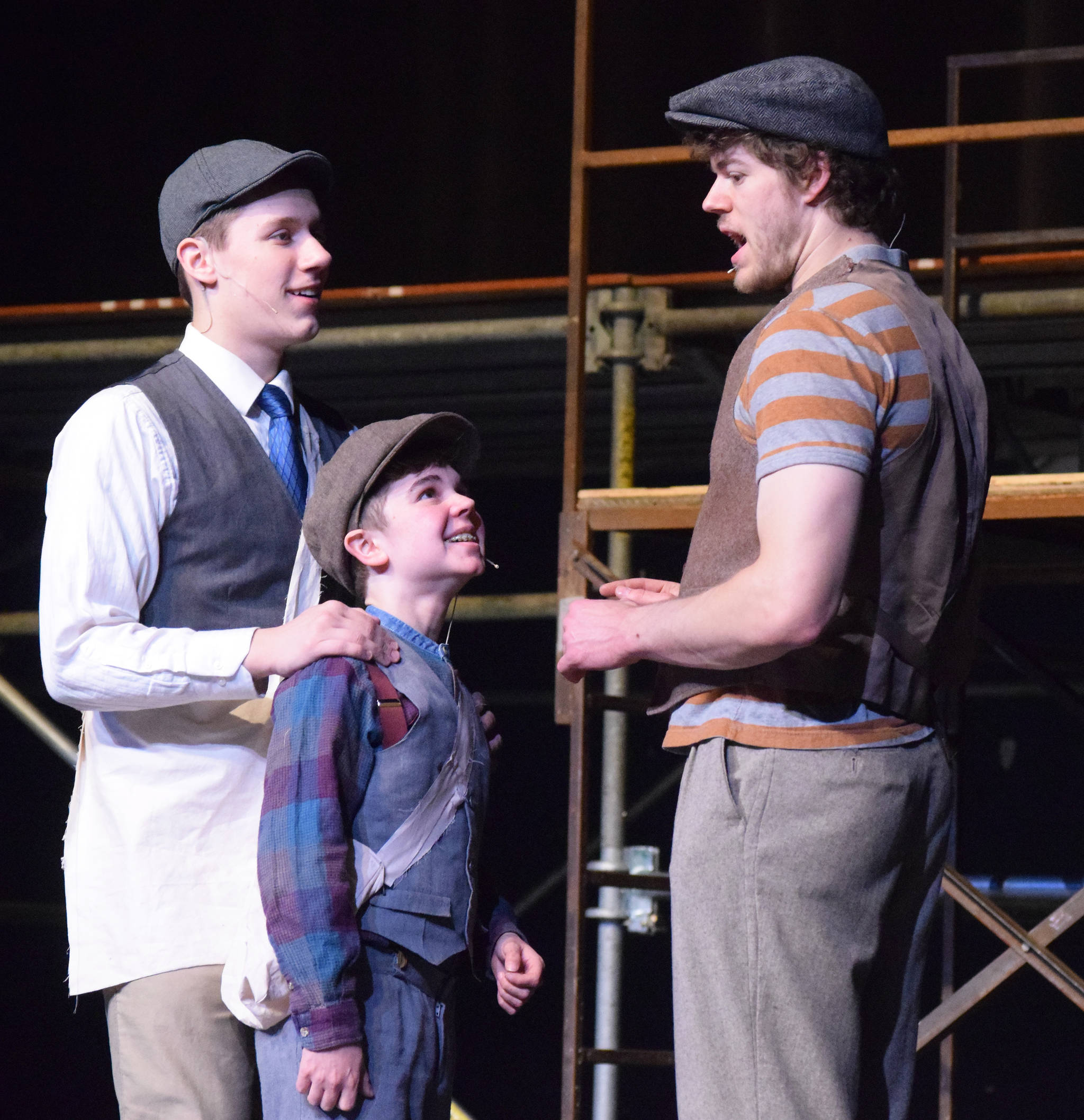 Collin Christiansen (right) practices a scene during rehearsal for “Newsies” on Wednesday, April 24, 2019, at the Nikiski High School auditorium. (Photo by Joey Klecka/Peninsula Clarion)