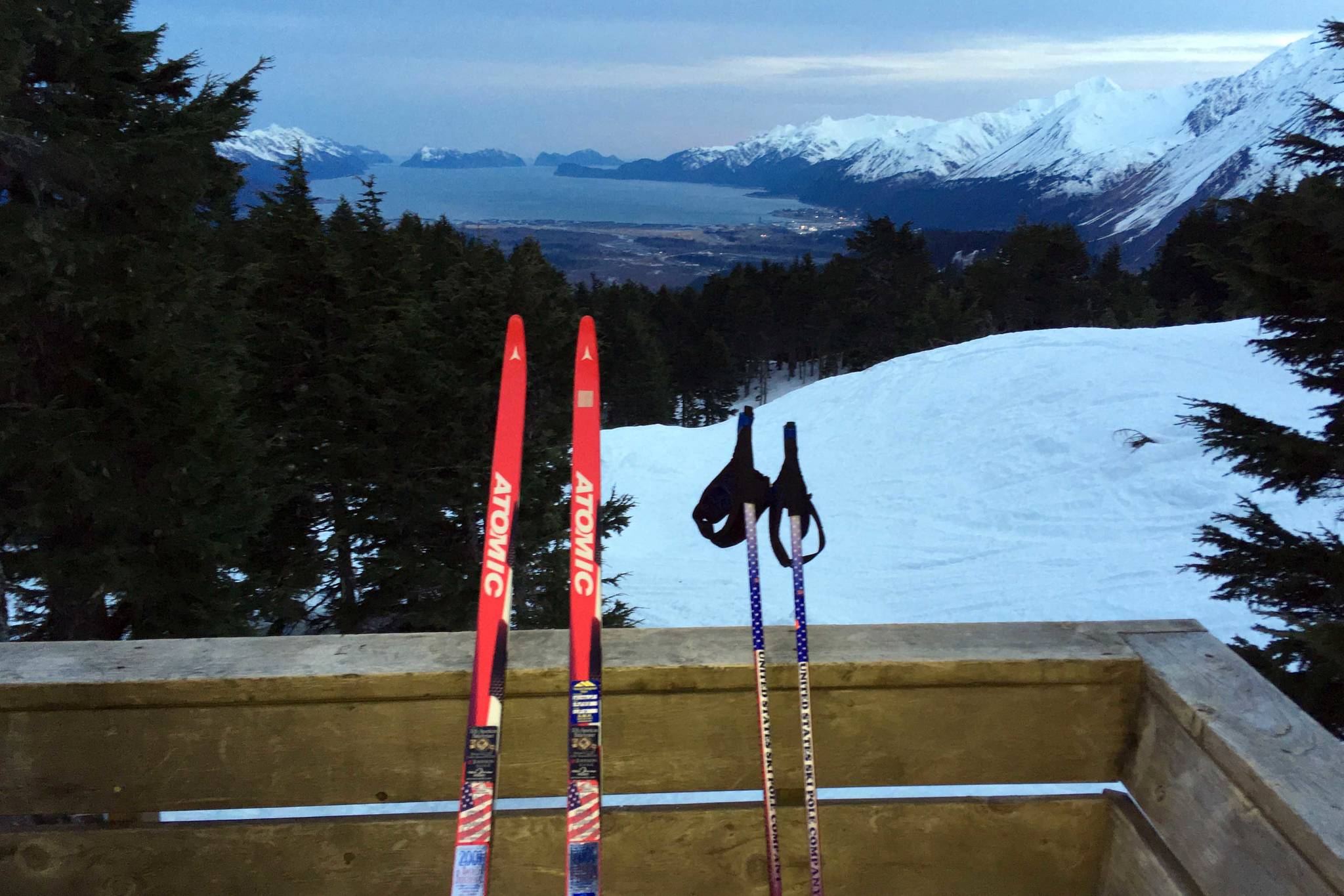 Skis and poles, ready for crust skiing, sit at the Dale Clemens Cabin above Resurrection Bay and Seward on April 12, 2019. (Photo by Jeff Helminiak/Peninsula Clarion)