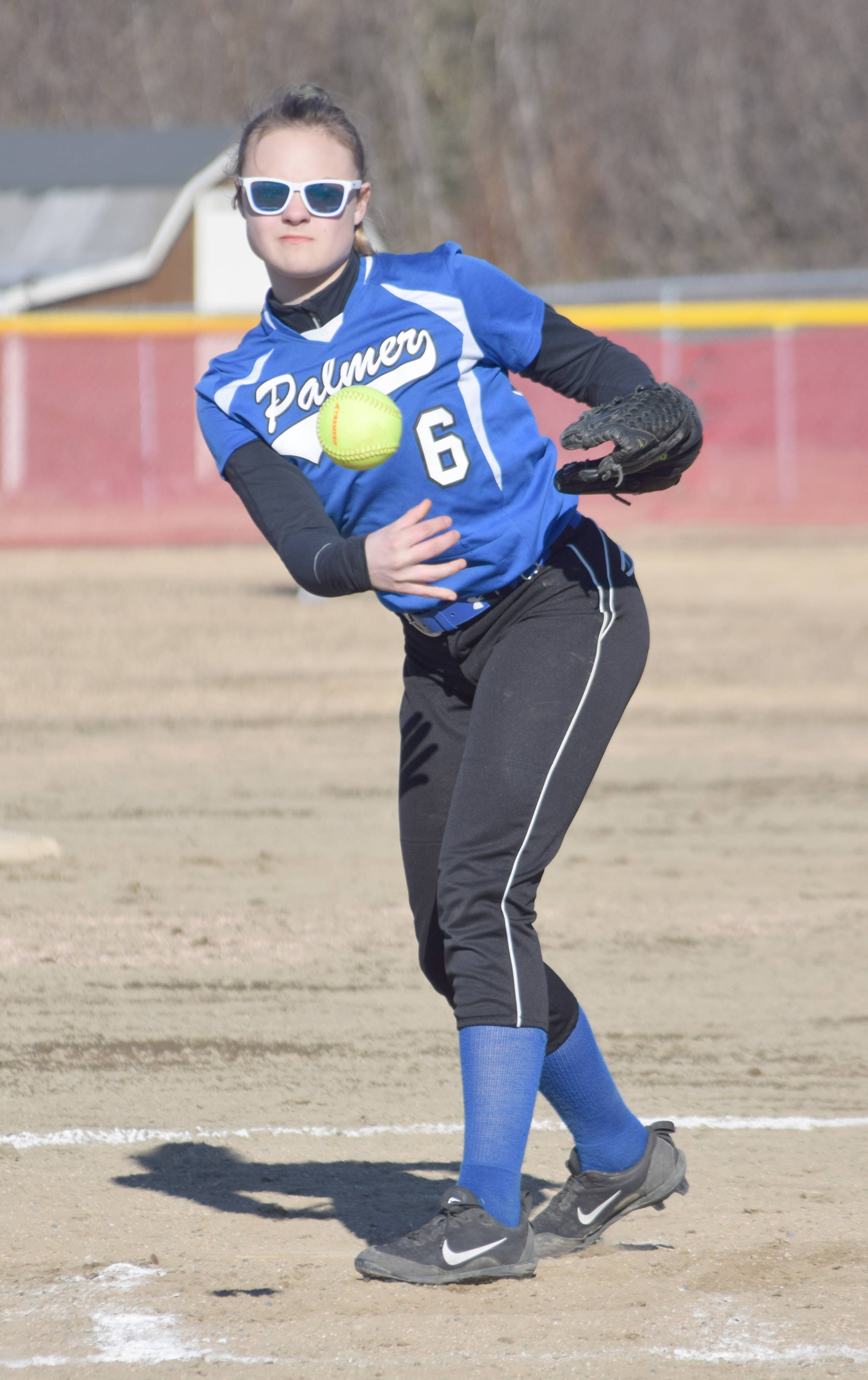 Palmer pitcher Janie Besse delivers home Friday, April 26, 2019, at Steve Shearer Memorial Ball Park in Kenai, Alaska. (Photo by Jeff Helminiak/Peninsula Clarion)