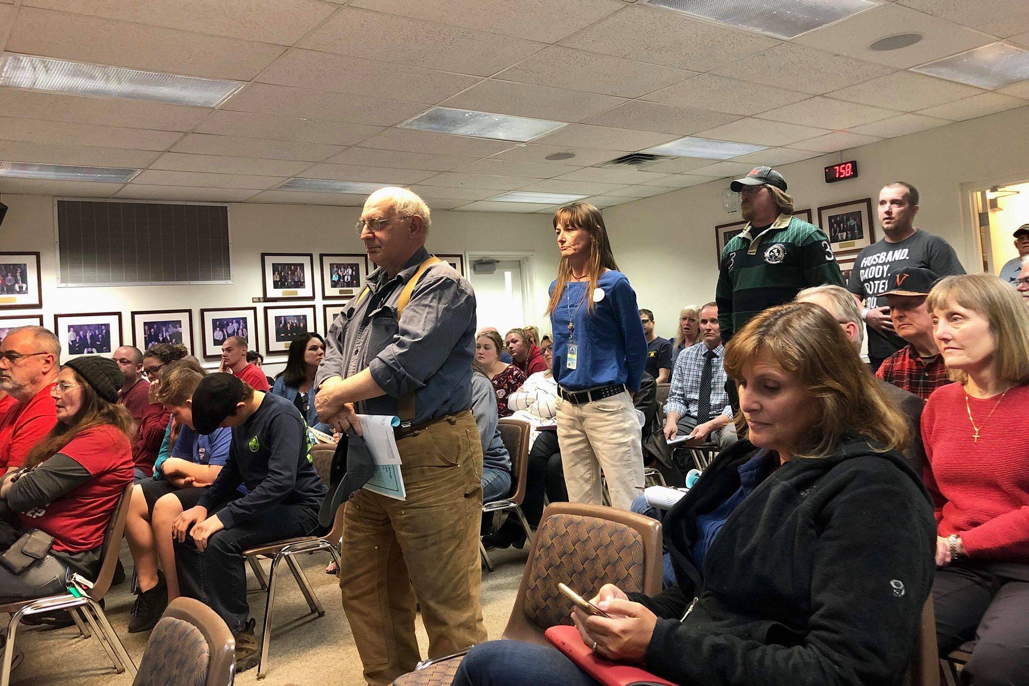 Bruce jaffa waits in line to speak to Kenai Peninsula Borough Assembly against closing Moose Pass School, on Tuesday, April 2, 2019 in Soldotna, Alaska. (Photo by Victoria Petersen/Peninsula Clarion)