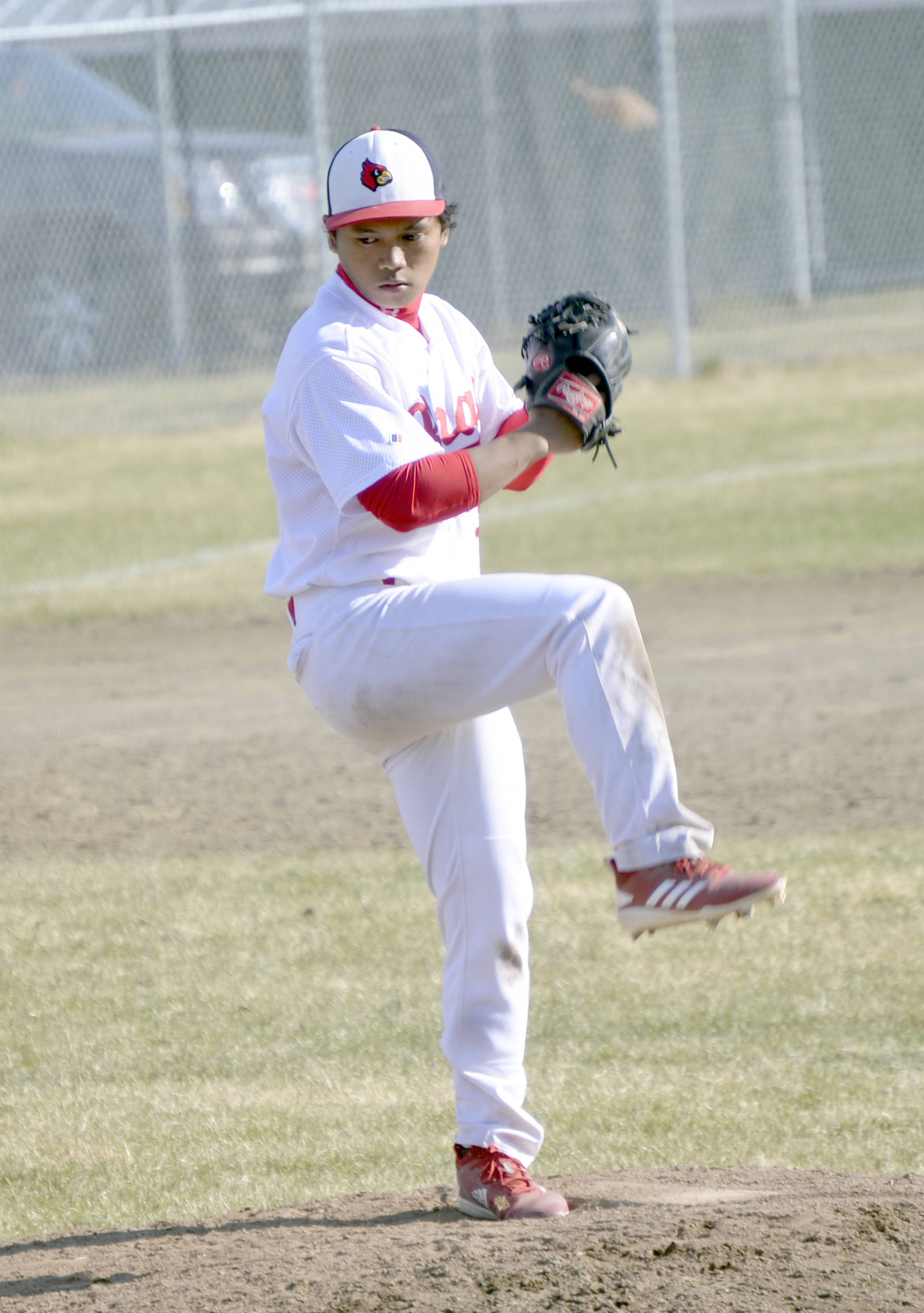 Kenai Central pitcher Harold Ochea delivers home Friday, May 3, 2019, at the Kenai Little League fields in Kenai, Alaska.