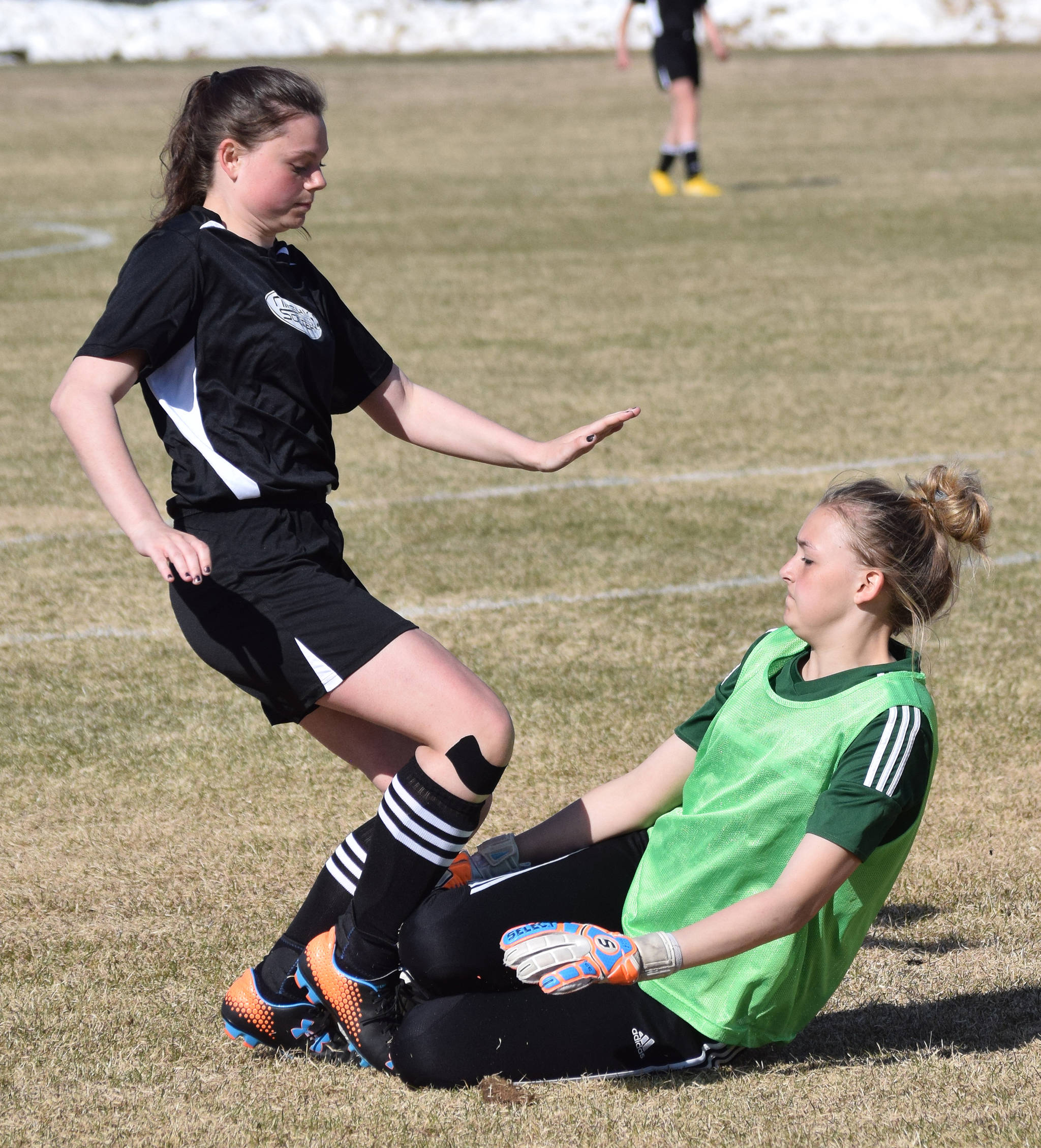 Nikiski’s Tawnisha Freeman (left) collides with Seward goalkeeper Eva Ballard in a race to the ball Friday afternoon in a Peninsula Conference contest at Nikiski High School. (Photo by Joey Klecka/Peninsula Clarion)