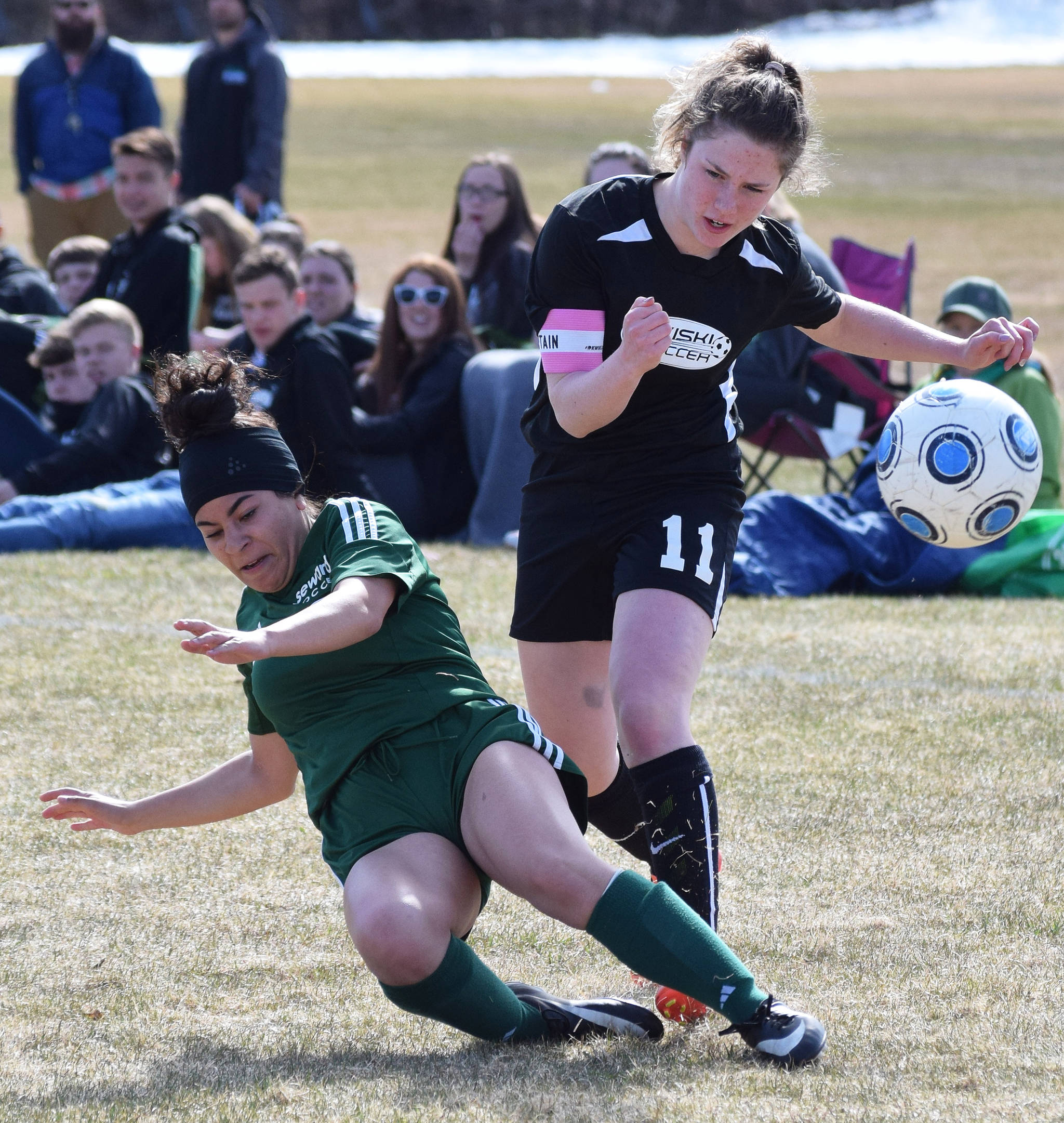 Seward’s Naomi Ifflander attempts to knock the ball from Nikiski’s Jordyn Stock (11) Friday afternoon in a Peninsula Conference contest at Nikiski High School. (Photo by Joey Klecka/Peninsula Clarion)