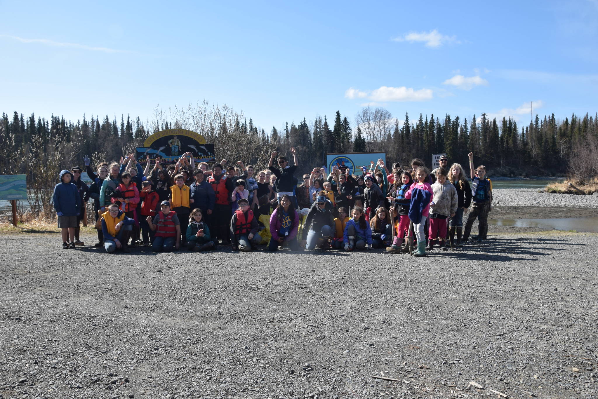 Students from Redoubt Elementary pose for a group photo during the 6th Annual Kids Kenai River Spring Cleanup at Swiftwater Park in Soldotna, Alaska on May 3, 2019. (Photo by Brian Mazurek/Peninsula Clarion)
