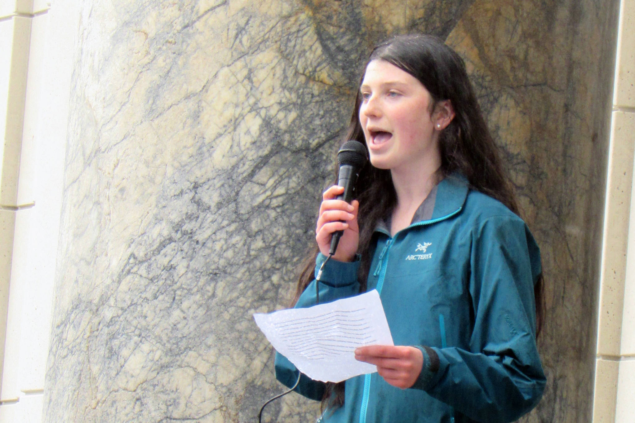 Linnea Lentfer, a JDHS sophomore, speaks about the importance of prioritizing climate change and the damage a dependency on fossil fuels has on the environment during a climate change rally at the Alaska State Capitol, Friday, May 3, 2019. (Ben Hohenstatt | Juneau Empire)