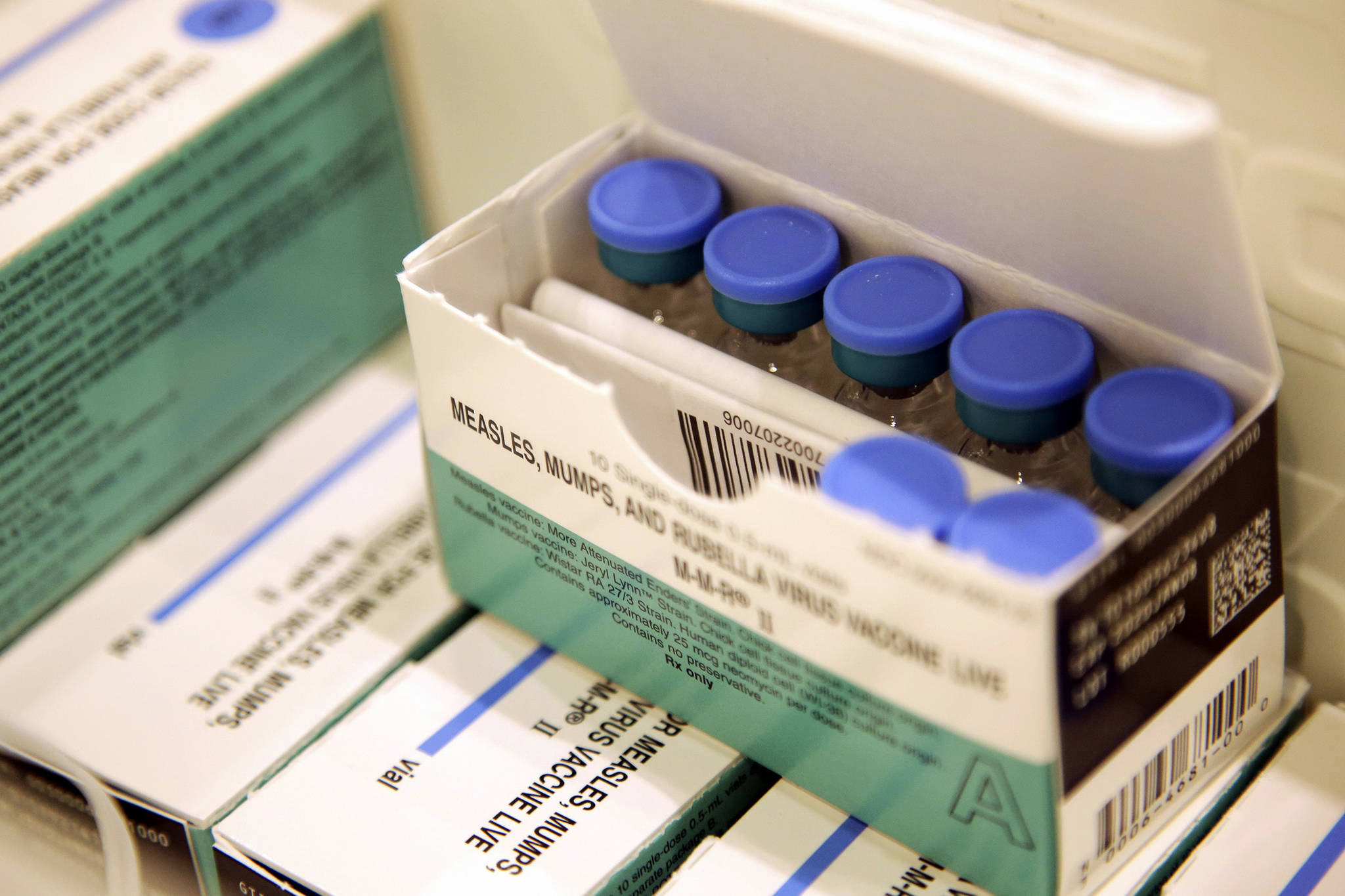 Measles, mumps and rubella vaccines sit in a cooler at the Rockland County Health Department in Pomona, New York. The MMR vaccine is a two-dose vaccine that typically ensures immunity to measles. (Seth Wenig | Associated Press)