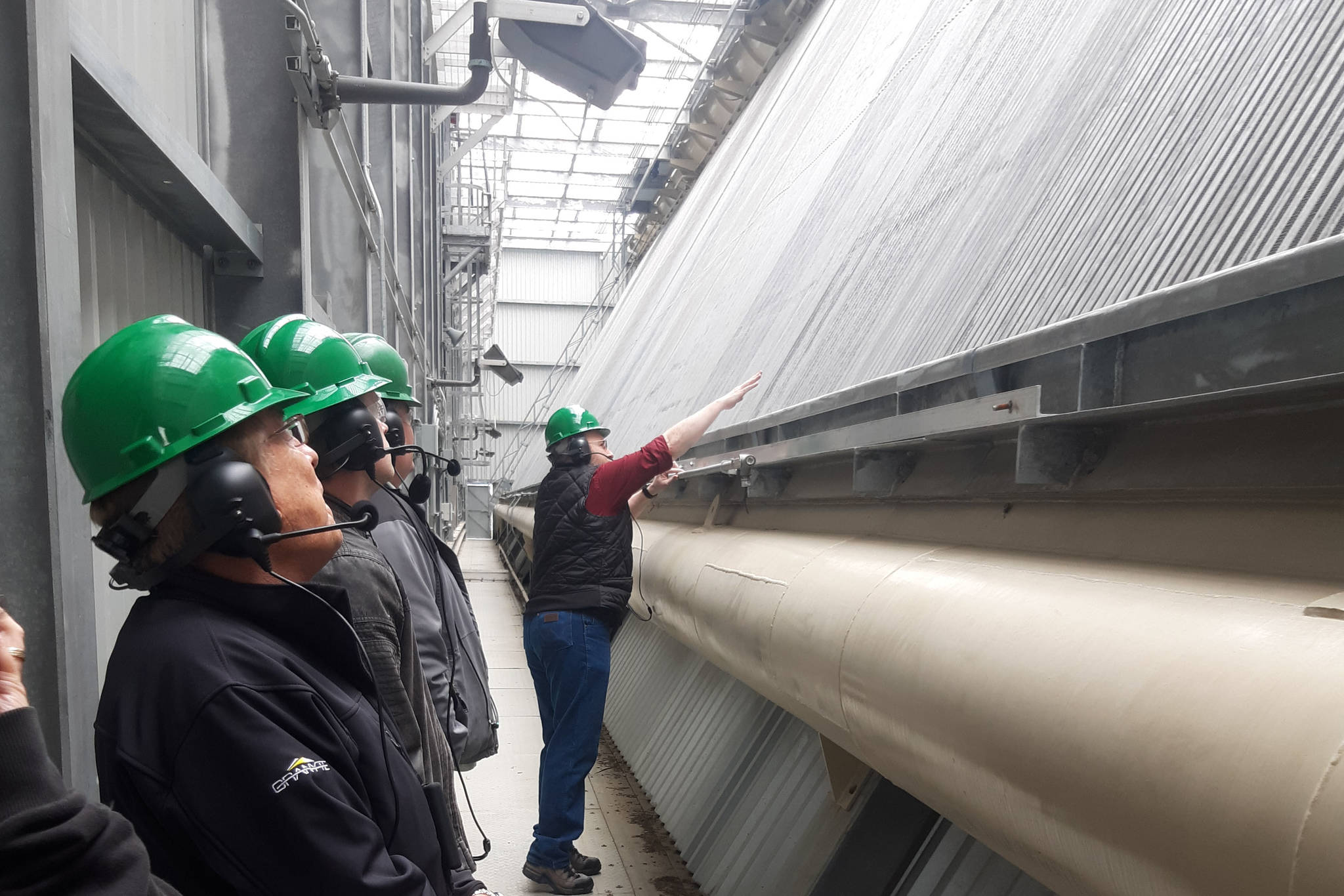 HEA Director of Power, Fuels and Dispatch Larry Jorgensen explains how the air-cooled condenser at the Nikiski Power Plant operates during a tour in Nikiski, Alaska on May 2, 2019. (Photo by Brian Mazurek/Peninsula Clarion)