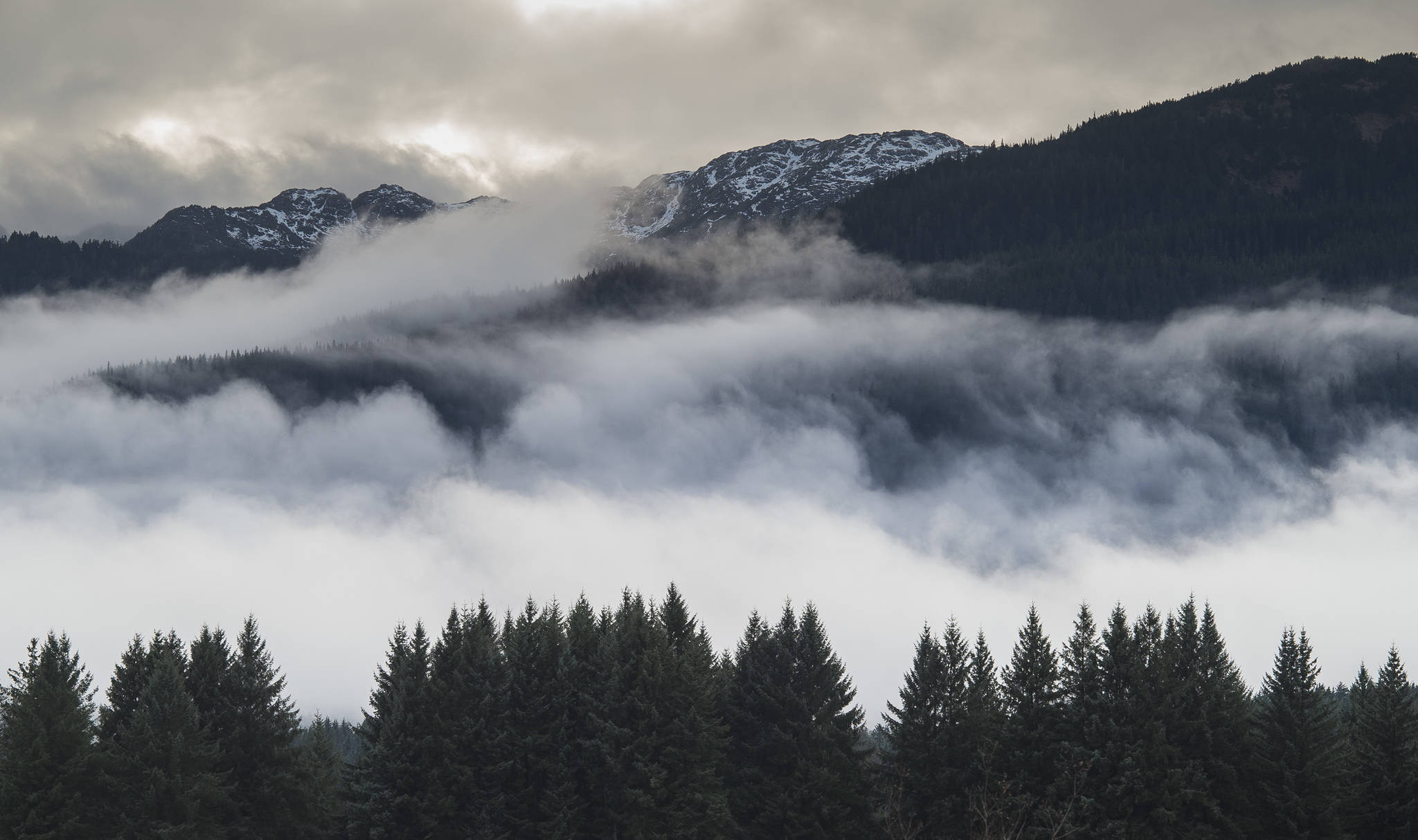 In this Nov. 29, 2018 photo, clouds swirl over Douglas Island. (Michael Penn | Juneau Empire File)