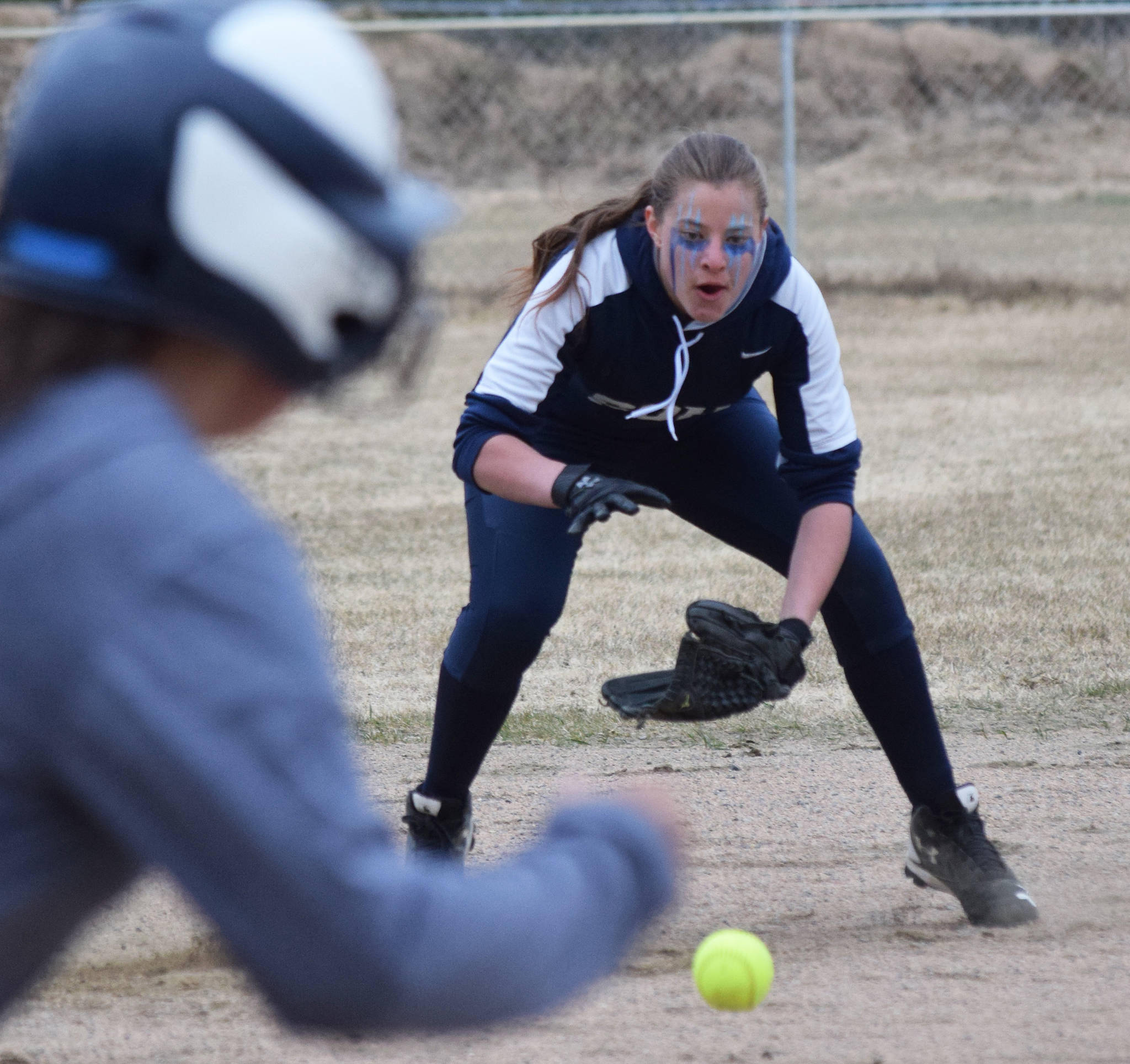 Soldotna third baseman Bailey Berger fields a grounder by a Homer batter Tuesday evening in a Northern Lights Conference game in Soldotna. (Photo by Joey Klecka/Peninsula Clarion)