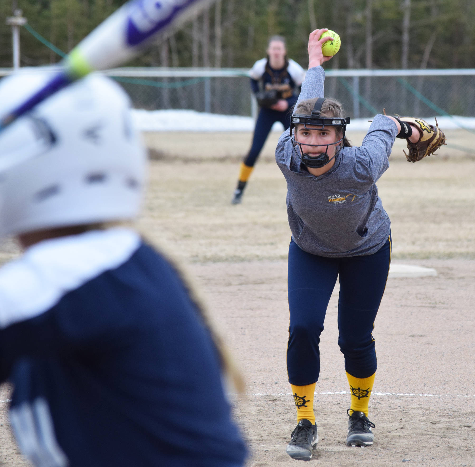 Homer’s Annalyn Brown unwinds for the pitch Tuesday evening in a Northern Lights Conference game against Soldotna in Soldotna. (Photo by Joey Klecka/Peninsula Clarion)
