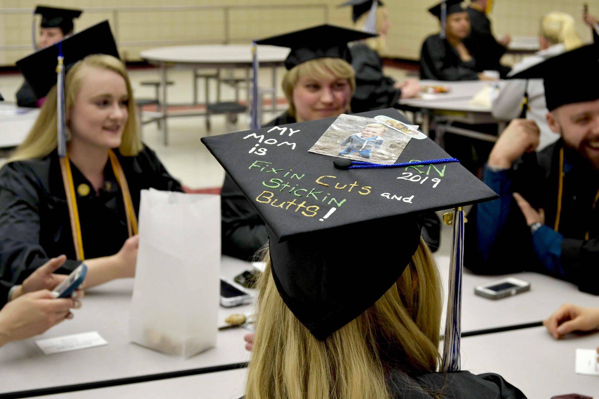 A group of nursing graduates from Kenai Peninsula College’s Kenai River Campus get ready to walk the stage and receive their degrees on Thursday, May 9, 2019, at Kenai Central High School in Kenai, Alaska. (Photo by Victoria Petersen/Peninsula Clarion)