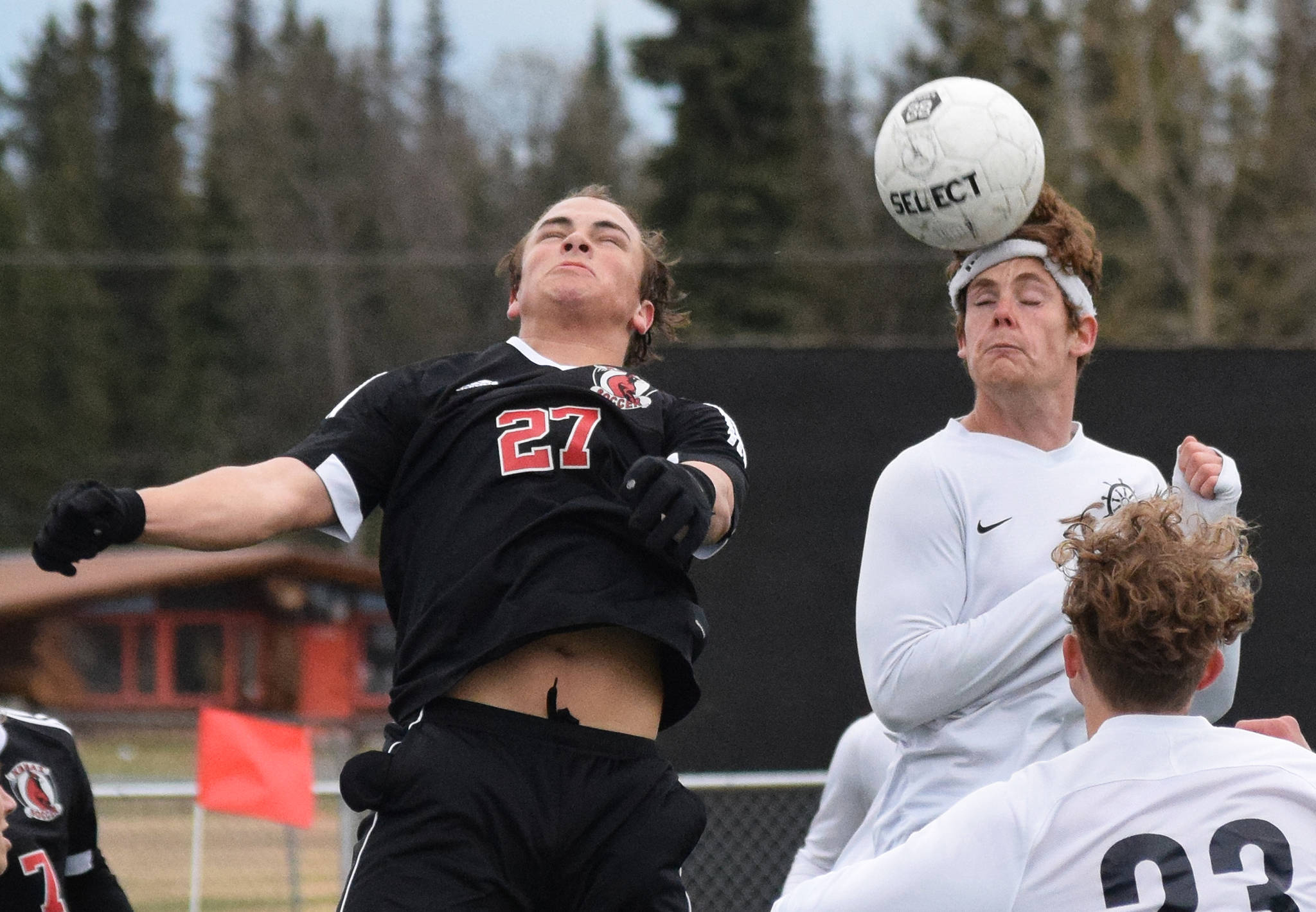 Kenai’s Nate Beiser (left) and Homer’s Avram Salzmann attempt a header on a free kick Thursday, May 9, 2019, in Kenai, Alaska. (Photo by Joey Klecka/Peninsula Clarion)