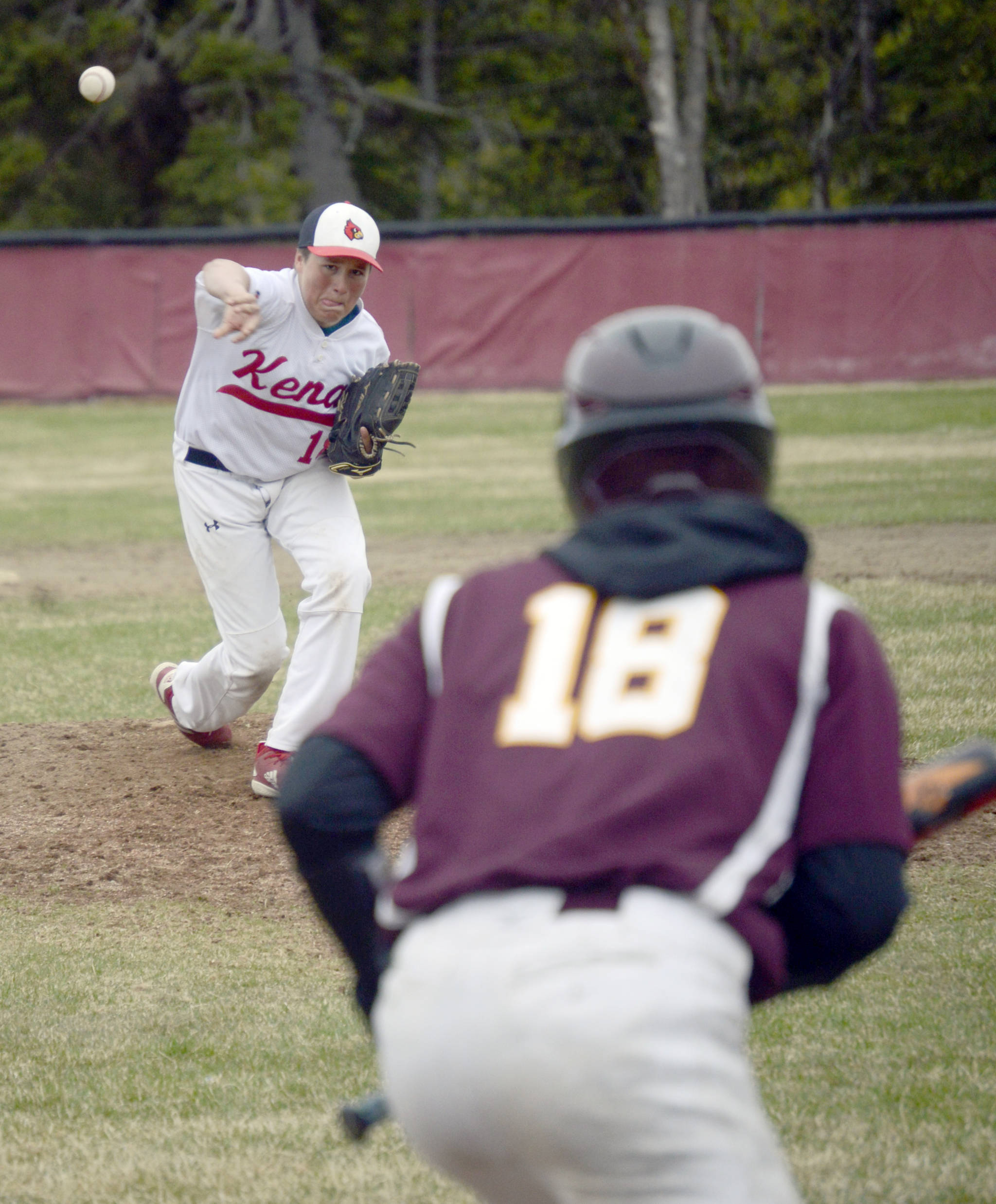 Kenai Central pitcher Simon Grenier delivers to Brett Hoffman of Grace Christian on Friday, May 10, 2019, at the Kenai Little League fields in Kenai, Alaska. (Photo by Jeff Helminiak/Peninsula Clarion)