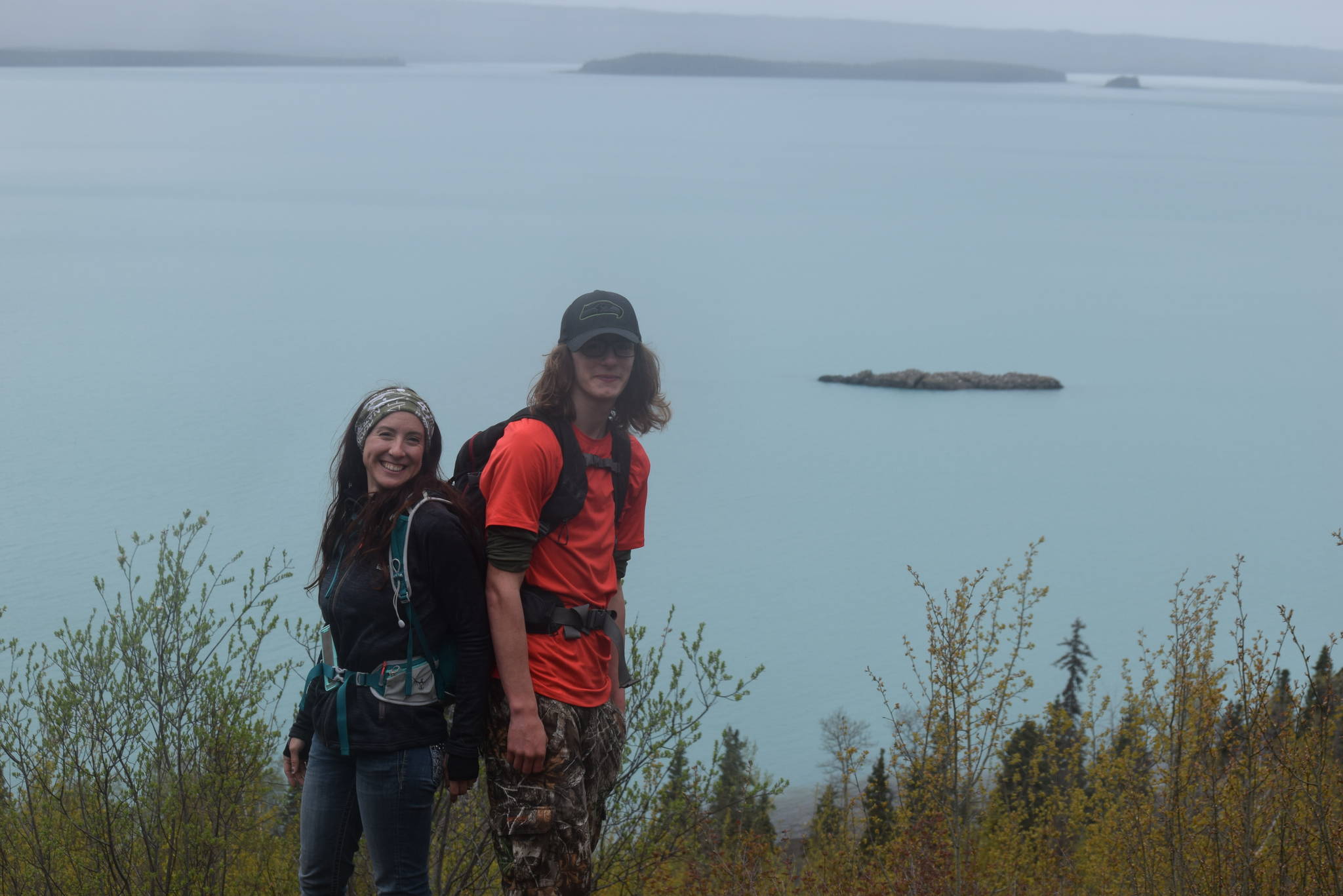 Tiffany Brand and her son pose for a photo over Skilak Lake while hiking the Vista Trail in Alaska on Saturday, May 11, 2019. (Photo by Brian Mazurek/Peninsula Clarion)