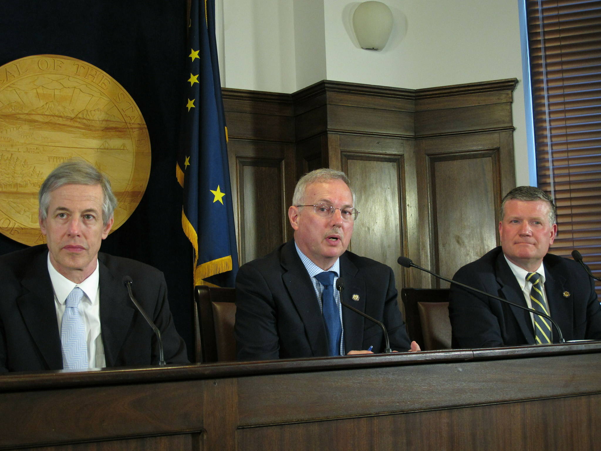 Alaska House Speaker Bryce Edgmon, center, speaks to reporters after the House failed to accept a Senate rewrite of a crime bill, Tuesday, May 14, 2019, in Juneau, Alaska. Also pictured are state Reps. Matt Claman, left, and Chuck Kopp. (AP Photo/Becky Bohrer)