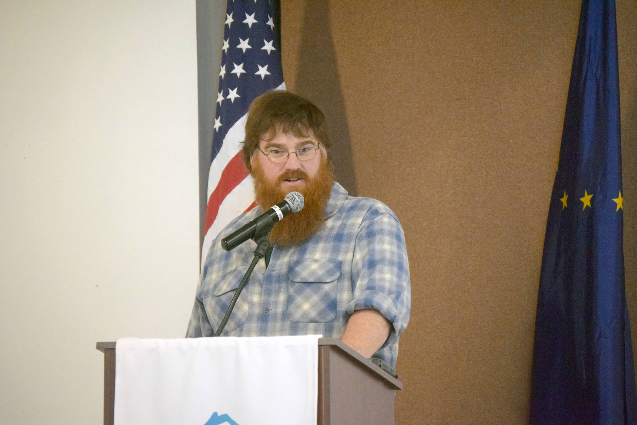 Drew Hamilton with the Friends of McNeil River gives a presentation to the Joint Kenai/Soldotna Chambers of Commerce in Kenai, Alaska on May 15, 2019. (Photo by Brian Mazurek/Peninsula Clarion)