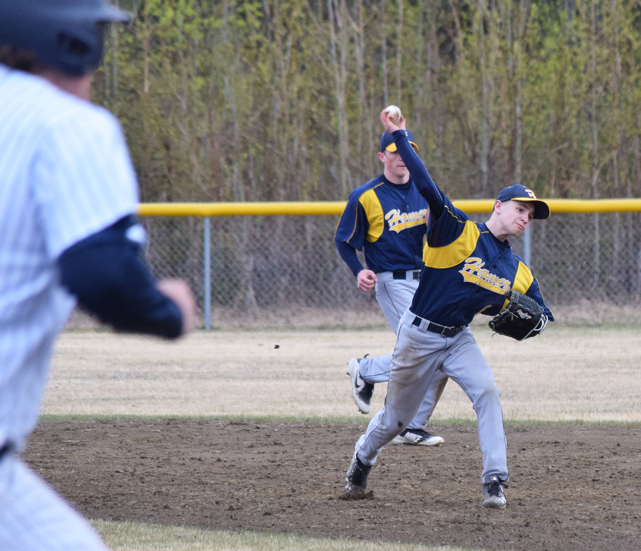 Homer second baseman Gabe Dash sends a groundball to first to record an out against Soldotna’s Jacob Boze, Wednesday, May 15, 2019, at the Soldotna Little League Fields in Soldotna, Alaska. (Photo by Joey Klecka/Peninsula Clarion)