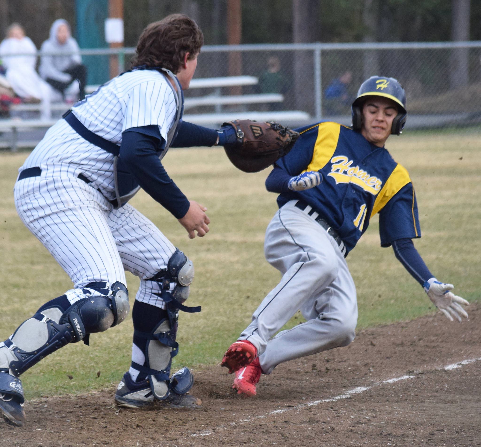 Soldotna catcher Jacob Boze applies the tag on Homer’s Karl Wickstrom at home plate Wednesday, May 15, 2019, at the Soldotna Little League Fields in Soldotna, Alaska. (Photo by Joey Klecka/Peninsula Clarion)