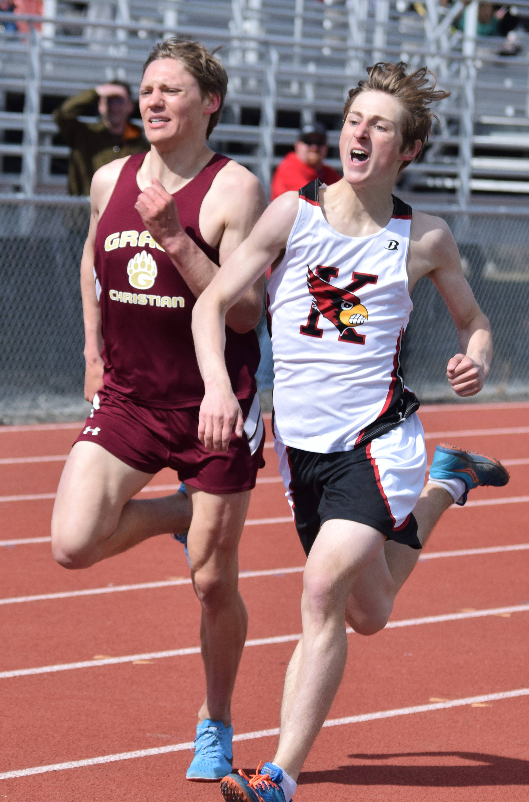 Kenai’s Maison Dunham (right) races Grace Christian’s Gabe Martin to the finish of the boys 1,600 meters Saturday, May 4, 2019, at the Kenai Invitational track meet at Kenai Central High School. (Photo by Joey Klecka/Peninsula Clarion)