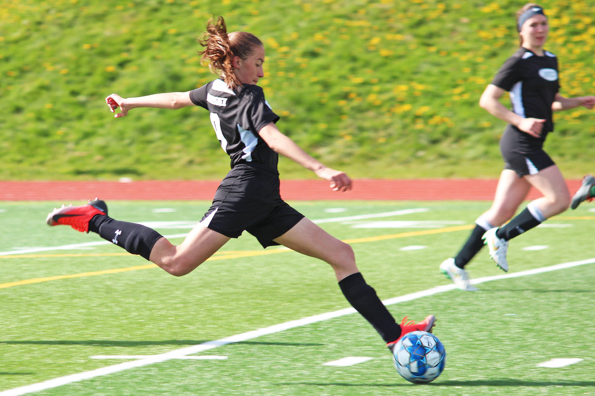 Nikiski’s Rylee Ellis sends the ball up the field during the first girls game of the Peninsula Conference Soccer Tournament on Thursday, May 16, 2019 at Homer High School in Homer, Alaska. (Photo by Megan Pacer/Homer News)