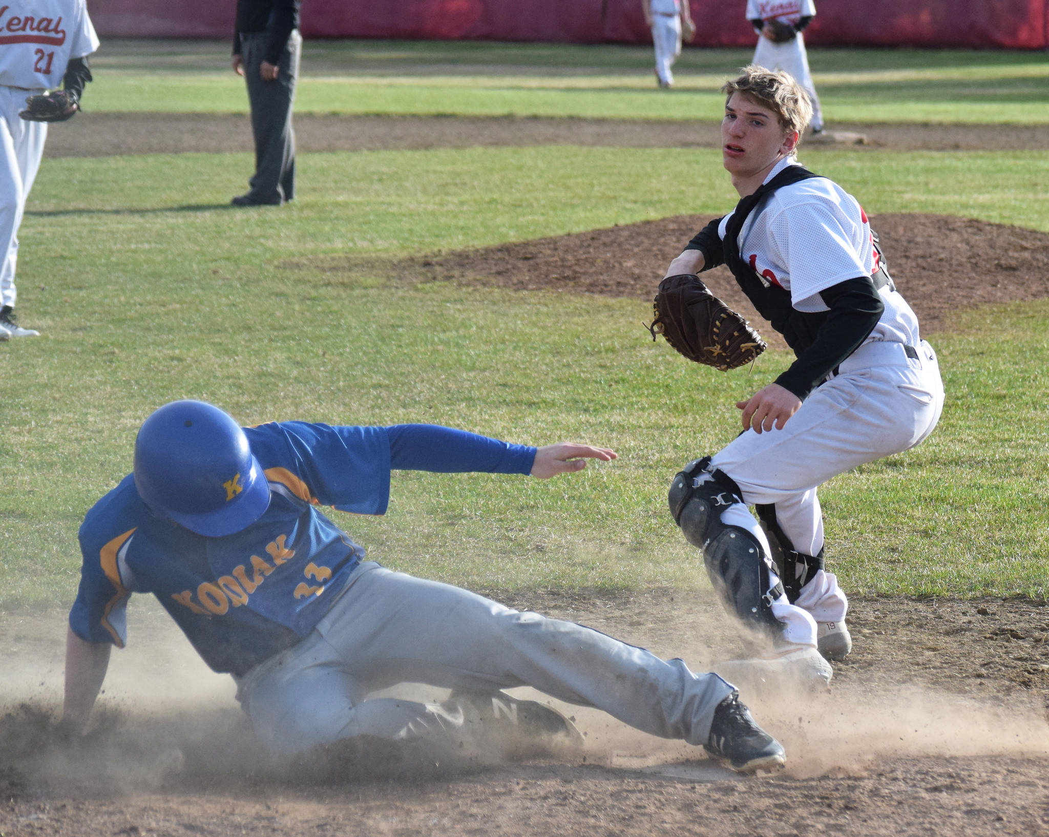 Kenai catcher Simon Grenier hauls in the relay throw too late against Kodiak baserunner Dylan Wynn Thursday, May 16, 2019, at the Kenai Little League Fields in Kenai, Alaska. (Photo by Joey Klecka/Peninsula Clarion)