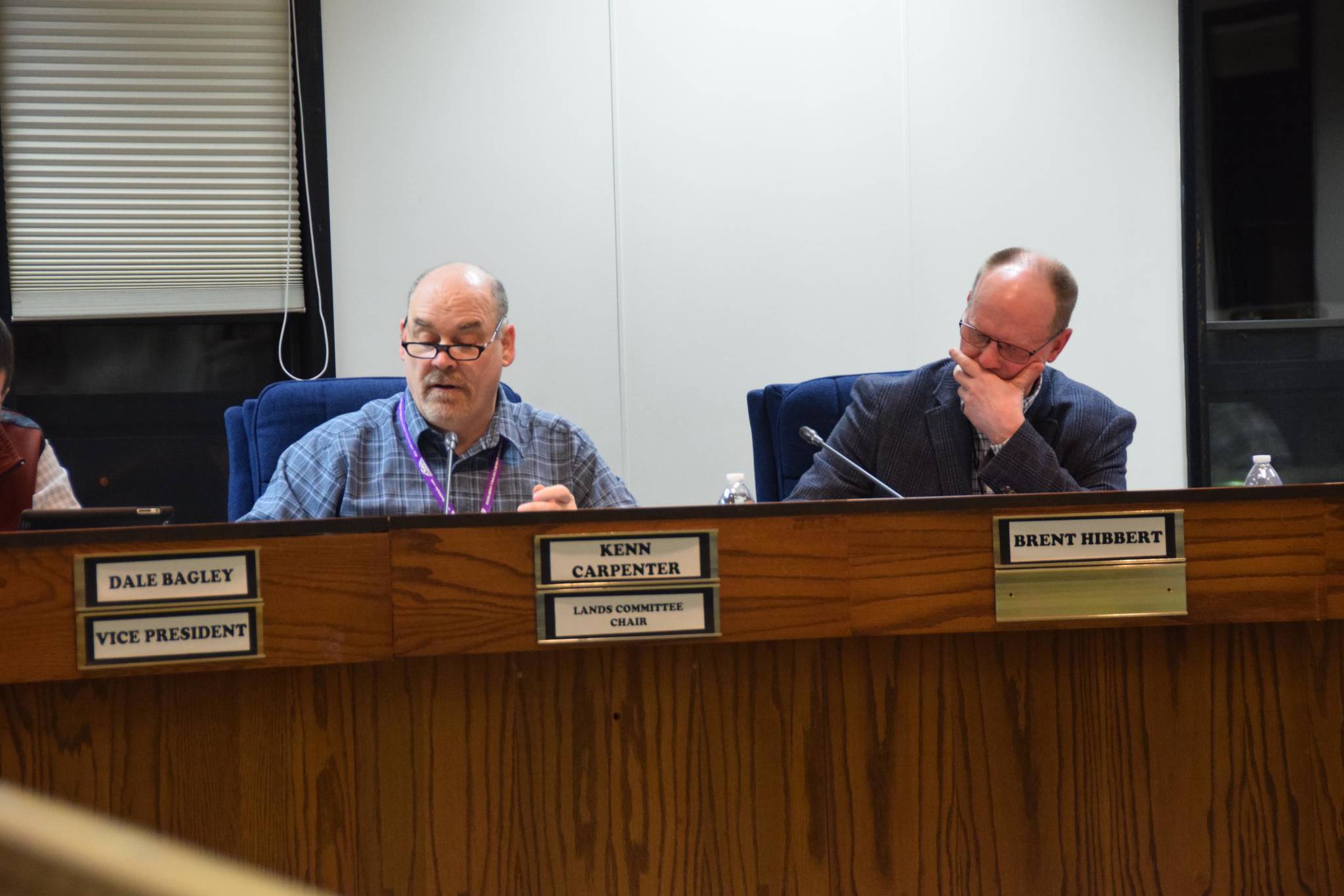 Assembly members Kenn Carpenter and Brent Hibbert discuss Ordinance 2019-03 at the Kenai Peninsula Borough Assembly Meeting in Soldotna on Tuesday, March 5, 2019. (Photo by Brian Mazurek/Peninsula Clarion)