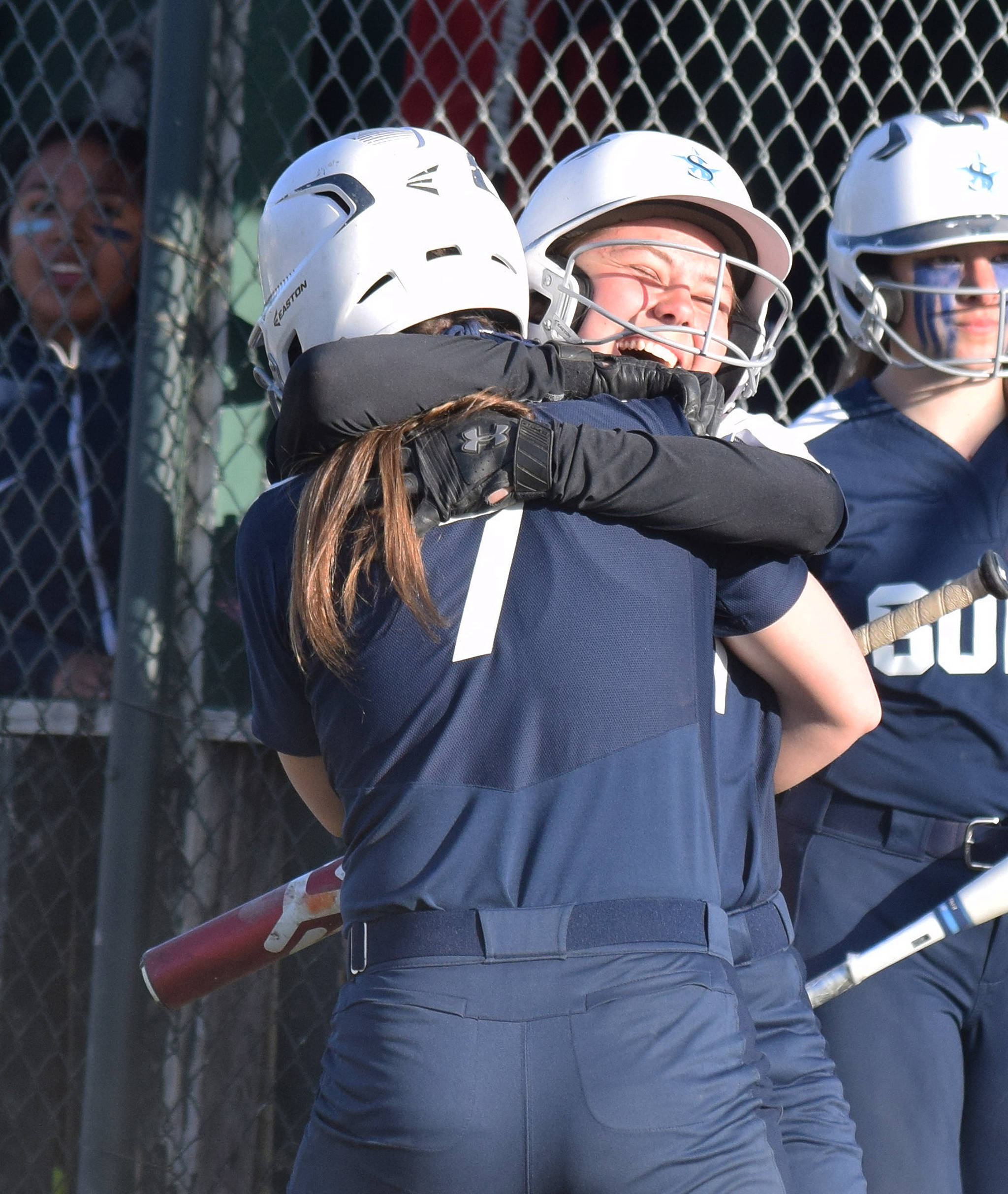 Soldotna’s Casey Card (right) celebrates with teammate Casey Earll after hitting an inside-the-park home run against Kenai Central Friday, May 17, 2019, at Steve Shearer Memorial Ballpark in Kenai, Alaska. (Photo by Joey Klecka/Peninsula Clarion)